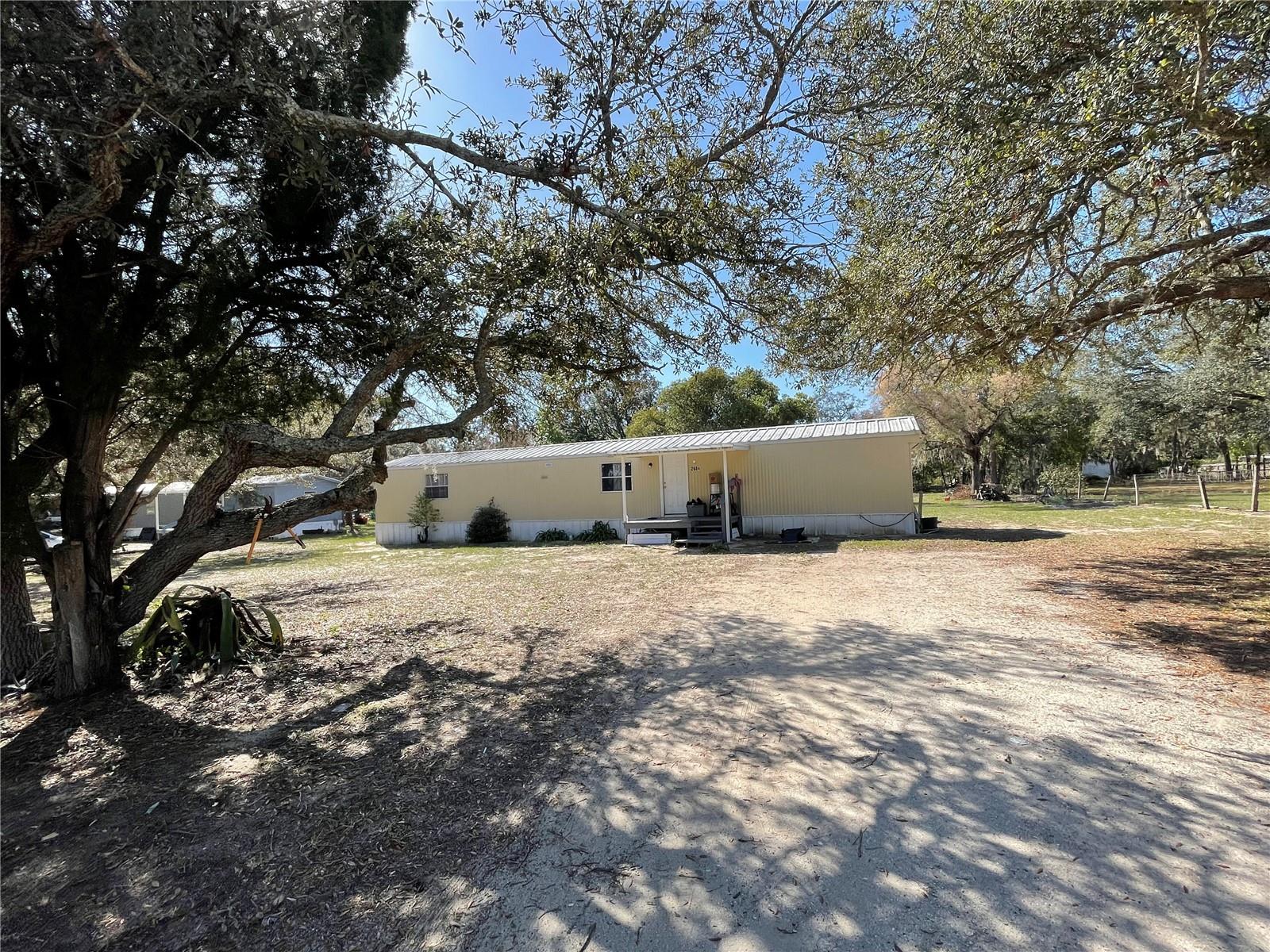 FL living at an affordable price or great investment property! This 2BD/2BA home is situated on 0.50 acres. Short distance to all shopping, schools, medical facilities, and restaurants. Make this your new winter retreat or year around home. Call today, don't miss this great investment opportunity.