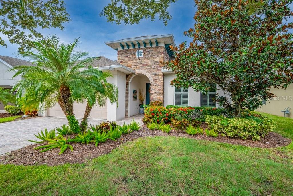 Model like Craftsman Style Home (with a Private Den) on a CONSERVATION LOT in Gated Encore of Fishhawk Ranch! Tampa Bay's Premier Resort Style 55+ community! Sitting pretty on a quiet dead-end street, across from the Community Club House with plenty of guest parking! Amazing Conservation & Sunset Views! The beautiful exterior will invite you into this lovely plan. This one story, open concept home is Dressed to Impress offering generously sized bedrooms, volume ceilings, 2.5 bathrooms PLUS a Study/Den/Home Office with French Doors AND a sliders flowing out to a Screened Lanai with an Extended Brick Paver Patio boasting a Picturesque Backdrop! Step inside and You WILL Fall in Love. Upon entering your eyes are immediately drawn to all of the wonderful appointments, handsome wood floors, crown moldings, Plantation Shutters, and More! Share your culinary masterpieces on the presentation island in the modern gourmet kitchen with a plethora of counter and cabinet space including an expansive island, tall cabinetry, beautiful pearl backsplash, and granite countertops. You will adore the tray ceiling in the Master Bedroom featuring unspoiled natural views, a large walk in closet with an HGTV worthy ensuite complete with a SUPER SHOWER!! Other special features include a fenced backyard, farm sink, water softener loop, BRAND NEW A/C 2025, and More!! Walk across the street and explore Encore’s State of the Art Club House ..The ‘Oasis Club’ featuring a Resort Style / Heated infinity pool, spa, basketball, PICKLE ball and BOCCE ball courts, grill stations, outside tv's, fitness center, card rooms and much more. A full-time activity director and a monthly calendar of events is available. The new owners will also have access to Fish Hawk Ranch West amenities just outside of Encore: The Lake house, community pool, fitness center, Parks, Playgrounds and other recreational facilities. This home is the complete package, move in ready! Call today to schedule a Private Tour.