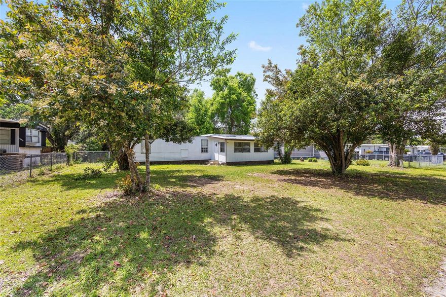 Charming and affordable opportunity in Ocala! This 2-bedroom, 1-bath mobile home sits on its own land—no lot rent, giving you true ownership and long-term value. The home is move-in ready, making it perfect as a primary residence, seasonal getaway, or income-producing investment property.

Enjoy a functional layout with comfortable living space and plenty of potential to make it your own. The fully fenced yard offers added privacy and security making it ideal for pets, outdoor entertaining, or simply enjoying your own space.

Conveniently located near shopping, dining, and major roadways, this property offers both accessibility and privacy. With a voluntary, low cost HOA and no lot fees, this is a fantastic opportunity for homeowners and investors alike. Call today to schedule your tour!