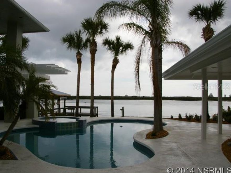 REDUCED $150K. Completely renovated inside and out! This magnificent Direct Intracoastal Riverfront pool home aims to please with 16 rooms and several outdoor leisure areas, including a covered boat DEEP WATER dock with lift with power/water, fish-cleaning station and in-water slip. Private gated island on the Intracoastal Waterway shared with the historical and prestigious Smyrna Yacht Club. Gourmet kitchen with center island, custom wood cabinets, granite, stainless steel high-end appliance package, pot-filler, butlers pantry, three living rooms (each with panoramic views)m,4 fireplaces (3 gas with remote), tile-wood-carpet flooring, vaulted ceilings with gorgeous paddle fans, free-form heated pool & spa, his & her offices, built-ins, second floor boasts a private master bedroom suite with private balcony, California-Closet Walk-in, luxury bath with heated towel racks, frameless glass shower, metal roof, Anderson windows, hurricane shutters, three separate a/c units, new ductwork, 2 water heaters (one tankless gas), second master suite has a 2-person jacuzzi tub with a rain shower. Included in one of the bedrooms is a kid-friendly loft. New fan-design paver driveway, Diamond-Brite pool finish in pool spa, new commercial heater for spool/spa, outdoor shower, lush tropical landscaping, irrigation sys, landscape and home lighting, paver walks, security sys and all new aluminum roof. Garage has epoxy flooring with space-saver wall system. Home professionally renovated and overseen by professional decorators for finely-appointed finishes, fixtures & window treatment. One-of-a-kind Architect-Designed! ;Water: City