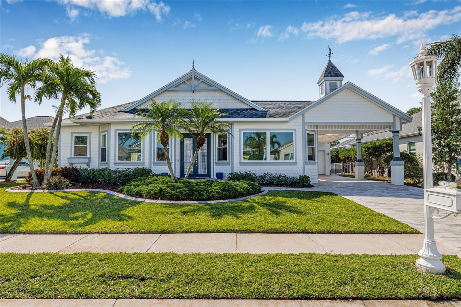 4 Bedroom | 3 Bath Waterfront Pool Home with Dock in The Inlets – Prime Street, Premier Community! Welcome to your Florida dream home in the coveted boating community of The Inlets! Situated on one of the neighborhood’s best streets, this beautifully updated 4-bedroom, 3-bath Key West-style waterfront pool home offers style, space, and seamless indoor-outdoor living—all with no storm damage or flooding.
From the moment you arrive, you'll be impressed by the fresh exterior paint, new pavers, lush tropical landscaping, and Porte Cochere with plenty of additional driveway space. Step inside to a bright, open-concept layout with soaring ceilings, an abundance of natural light, and tasteful finishes throughout. The chef’s kitchen is a standout, featuring quartz countertops, white cabinetry, tile backsplash, new 2024 stainless appliances, a gas range, bar seating, and a sunny breakfast nook. The split floor plan ensures privacy, with a spacious primary suite offering pool views, sliders to the lanai, dual closets with custom systems, and a newly remodeled ensuite bath with quartz dual vanities, a Jacuzzi tub, walk-in shower, and private water closet. Each bedroom includes custom closet systems, maximizing organization and storage throughout the home.
Four sets of sliders open to the screened lanai and patio, where you'll find a sparkling pool, new pavers (2024), and serene freshwater canal views.
This home is packed with upgrades: New roof (2018) with radiant barrier, Lennox HVAC (2015), Rinnai tankless gas water heater (2020), 220 EV Garage outlet, lawn irrigation, landscape lighting, electric garage attic stairs, and electric storage lifts. A newly added 3rd bathroom complements the thoughtful renovations throughout.
Bring your boat and enjoy 75 feet of seawall with a dock offering shore power and water hookup—just a 30-minute cruise to the beaches of Anna Maria Island! The Inlets offers residents tennis courts, a waterfront park, nature trails, kayak launch, and playground, with no CDD, low HOA, and low flood insurance. Fruit lovers will adore the mature orange, lemon, lime, tangelo, and olive trees—adding yet another special touch to this exceptional home.