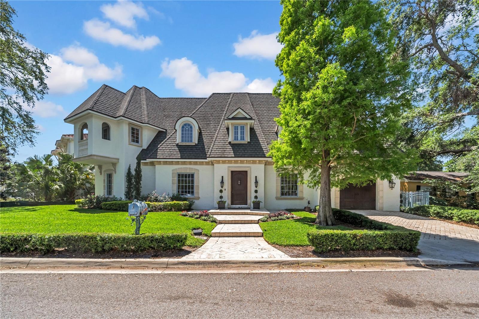 This French Provincial custom home was built in 2007 and completely updated with modern finishes in 2020. Located in Waverly
Park, one of Tampa's best kept secrets. You get the luxury of being in the center of South Tampa but with the comfort of a secluded
neighborhood. Upgraded finishes include custom made limestone exterior trim, impact rated and double insulated Pella Windows.
Luxury kitchen features Aquaverde Marble, Subzero refrigerator, and a La Cornue oven and range. Solid core Brazilian mahogany
doors throughout. Full bedroom/en suite bathroom downstairs. Oversized primary suite featuring Carrera marble tub deck and a huge
walk-in closet. 4 bedrooms plus an office/den. Best of all the home and neighborhood did not experience any flooding during the past
two hurricanes. Call to schedule your tour today.