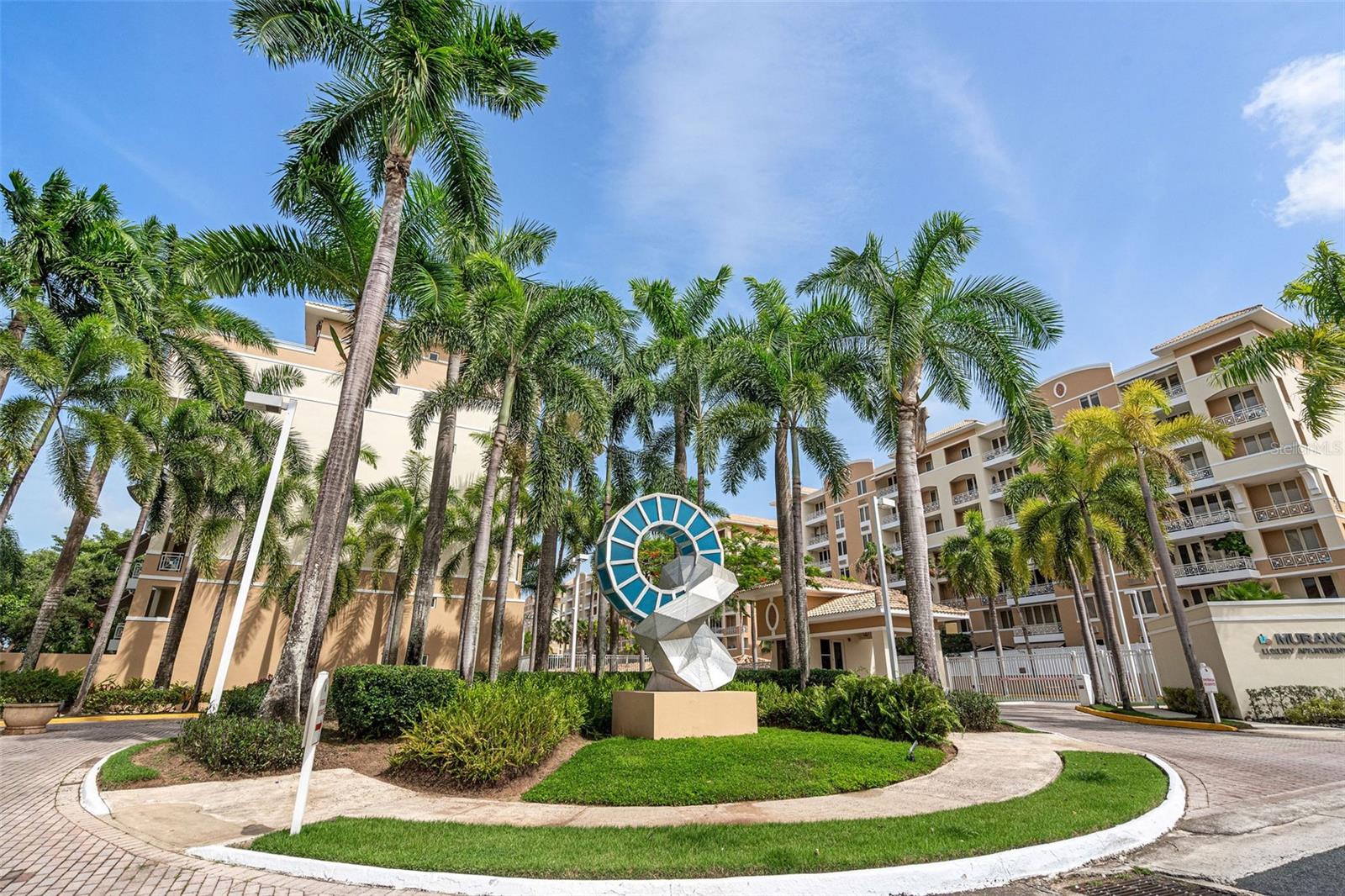Elegant Residence with Panoramic Views and Resort-Style Amenities
Experience the comfort of a private home with the convenience of condominium living. The main floor features three spacious bedrooms, two full bathrooms, powder room, a modern eat-in kitchen, family area, and a large laundry room with storage. Expansive windows frame with picturesque views of lush trees and charming red-tile rooftops, filling the space with light and serenity.
Upstairs, enjoy a private bedroom with full bath, a spacious family room, and access to a generous terrace—perfect for entertaining or relaxing in style.
Residents benefit from resort-style amenities, including a pool, racquetball court, playground, gym, residents’ lounge, and 24-hour security, along with three covered parking spaces.
A rare opportunity that combines elegance and privacy.