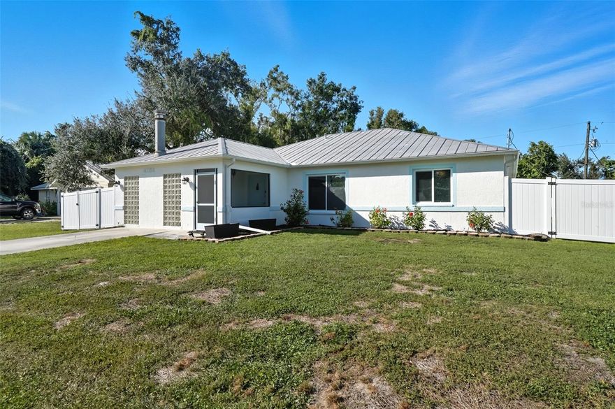 Welcome to this beautifully updated home in a desirable North Port location, just minutes from shopping, dining, schools, and easy access to I-75. With thoughtful upgrades inside and out, this residence is truly move-in ready.

Step inside to discover a spacious 2-bedroom, 2-bathroom layout with a versatile family room with some storage, featuring a wood-burning fireplace—perfect for a cozy retreat, office, or den. The split floor plan provides privacy, while new tile flooring in the great room and both bedrooms adds a fresh, modern feel. The inviting great room is filled with natural light from the large windows and opens to the fully screened lanai through attractive sliding glass doors, creating the perfect flow for indoor-outdoor living.

The kitchen has been refreshed with some new cabinets, and quartz countertops, an expanded island with elegant marble countertop (for it's heat resistance), offering both functionality and style for cooking, entertaining, and gathering. The interior and exterior have been freshly painted, giving the home a crisp, welcoming appeal.

Additional updates include: new hurricane impact windows (2024), AC, hot water heater, and electrical panel (2023), plus a brand-new range/oven, dishwasher, washer, and dryer (2024). The durable metal roof (2007) provides peace of mind, and the property is not located in a flood zone.

With modern finishes, low-maintenance living, and a convenient North Port location close to Gulf beaches, parks, and Warm Mineral Springs, this home is packed with character and ready for its new owner.