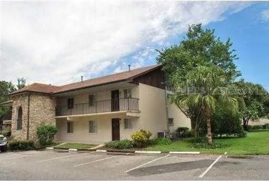 PRICE REDUCTION! This charming GROUND FLOOR end unit CONDO offers a peaceful retreat with all the right touches. Featuring 2 bedrooms and 1.5 baths, this unit has a spacious open floor plan with ceramic tile in Kitchen & Bathrooms and laminate wood flooring in the Living Room and Bedrooms for easy maintenance!  Price includes all Kitchen appliances and the stackable washer/dryer just steps away! You or your  Guests will be just MINUTES from the world-famous LEGOLAND RESORT—making it ideal for vacationers looking to enjoy all the fun Central Florida has. Plus, you'll be close to local favorites like restaurants, shopping, and essentials, with everything just minutes away. Whether you're seeking a vacation retreat or a year-round home, this condo has it all! Small Fee gives you access to year round swimming in a sparkling resort style swimming pool! Easy to Show! If you are looking to call Orchid Springs your new home, call to schedule a look today!