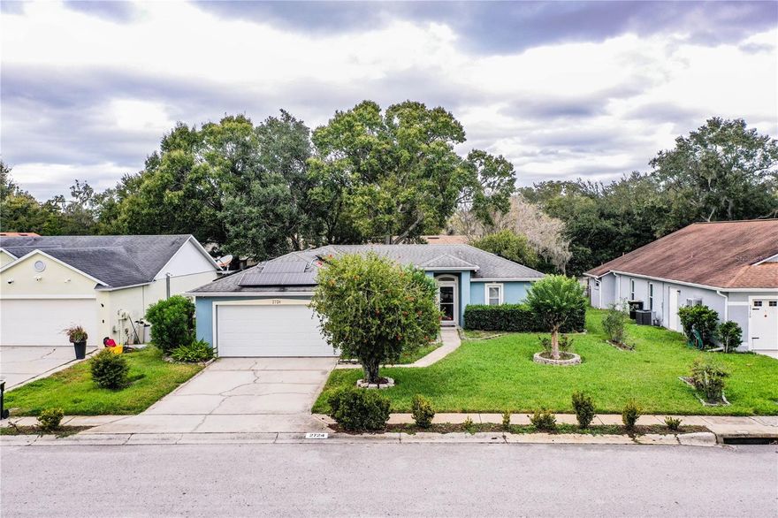 Nestled in this established Sundance community, you will find this 3/2 home that offers comfort and energy efficient amenities.  This home features tile floors throughout, natural light coming from the air conditioned sun room that was installed in 2008, as well as some impact windows that were installed in 2007. The kitchen offers cabinets with granite counters and stainless appliances. For peace of mind there is an ADT hard wired security system installed with cameras.  The beautiful back yard which has an irrigation system is ideal for gardening or play and the home features an indoor laundry room and two car garage.    Recent updates are the Solar PV System installed in 2021 which you will own free and clear  and an enclosed bedroom with office in addition to the master and two other bedrooms.   The roof was done in 2008 and a new AC was put in 2018 and duct work in 2019.