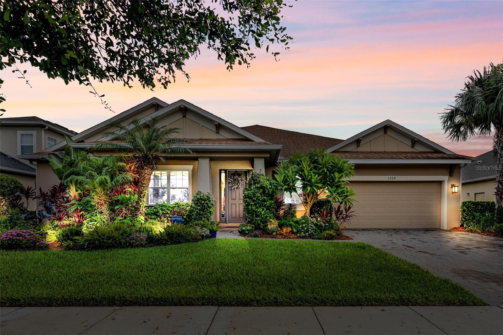 Welcome to this stunning craftsman style retreat in the heart of Oviedo, offering nearly 3,300 square feet of beautifully designed living space with the perfect blend of privacy and openness. An inviting lush, and tropical landscaped home located in The Retreat at Lake Charm, a cozy enclave of just 46 homes north of the Lake Charm Historic District. This home provides a peaceful setting while being close to top-rated schools, UCF, dining, and shopping. Step inside and immediately feel the spaciousness of this open floor plan, highlighted by trayed ceilings in the foyer, rotunda and 8-foot archways throughout. The extended primary suite is a true sanctuary, featuring a luxurious en-suite bath with a large separate shower, soaking tub, and bespoke walk-in closet to keep everything organized with ease. The gourmet kitchen showcases a 10ft majestic granite island with stylish tile backsplash and stainless steel appliances, including a top of the line cafe GE refrigerator with in-door Keurig and custom cabinetry, making it the heart of the home and perfect for gatherings. Attached is a custom designed pantry providing multiple options for storage. Whether you need a quiet spot to work or an open entertainment area, the dedicated office space offers flexibility for your lifestyle with substantial cabinetry, a wine fridge and wet bar. The media room is the perfect escape for movie nights or easily transform into a game room or man cave. Love outdoor living? Open the 12-foot telescopic sliding doors to seamlessly extend your living space onto the spacious covered lanai, ideal for relaxing mornings, weekend barbecues, or evening gatherings under the stars. This home is filled with thoughtful touches and quality finishes throughout, providing a move-in-ready lifestyle for its next owner. Don't miss your opportunity to live in one of Oviedo’s most desirable communities and only minutes to 417 and SR 434. Schedule your private showing today and discover the lifestyle waiting for you at 1208 Fieldstone Circle!