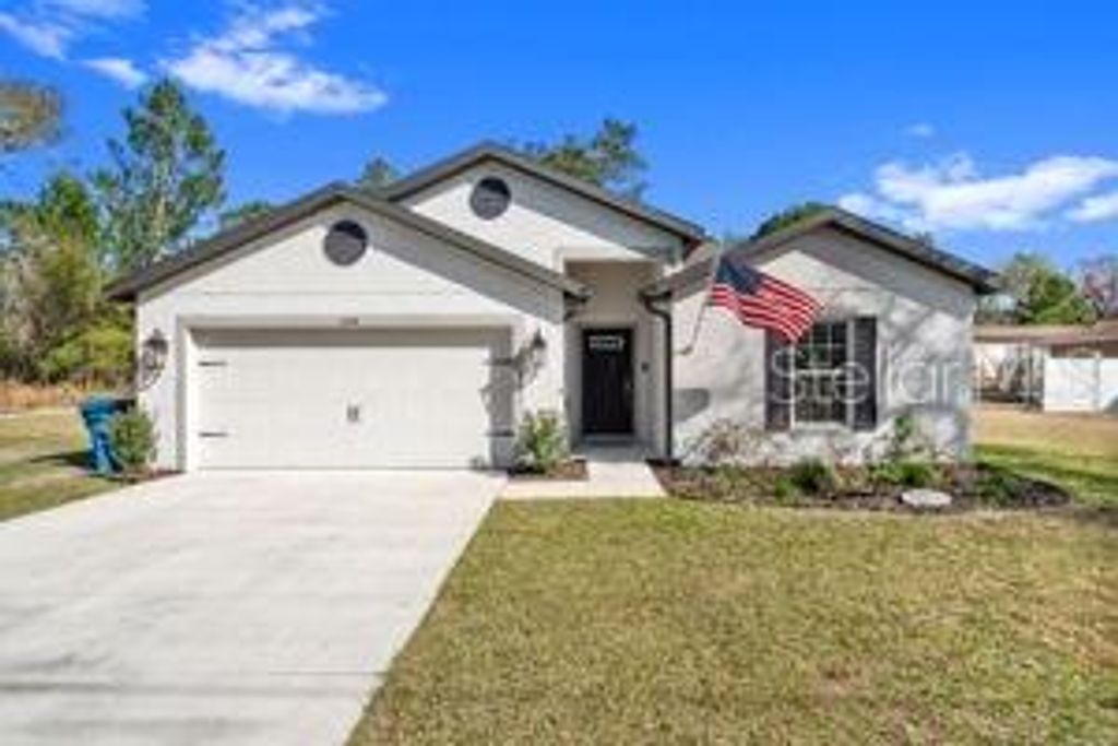 Photo of 11014 Golden Warlber Rd, Brooksville, FL 34613 (MLS # W7882609)