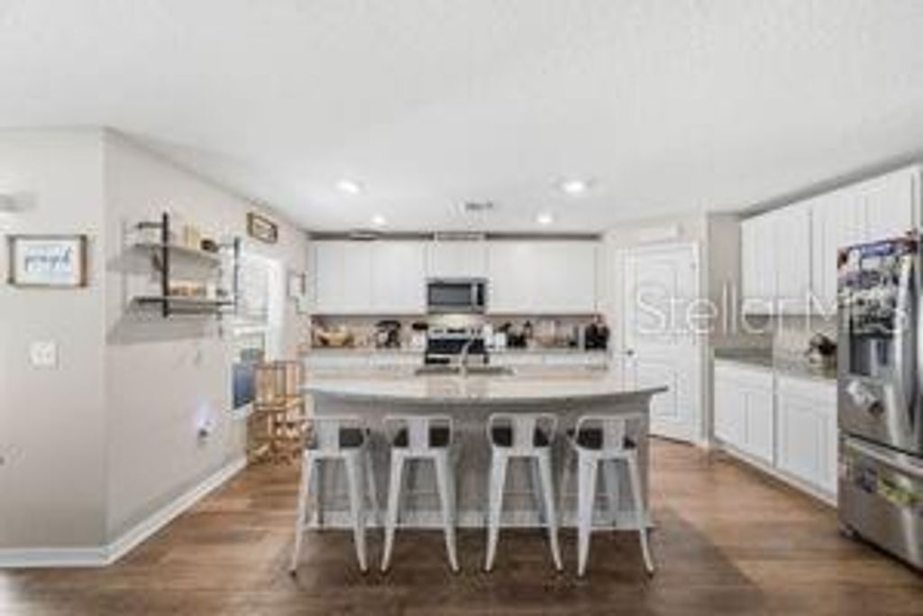 Photo of 11014 Golden Warlber Rd, Brooksville, FL 34613 (MLS # W7882609)