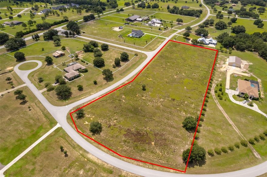 Huge price adjustment! A Ready-to-Build Opportunity in a Coveted Gated Community
Positioned in one of the area’s most desirable equestrian-friendly neighborhoods, this fully cleared lot offers the perfect blank canvas to bring your dream home to life. Whether you're ready to build now or planning for the future, the freedom of no build timeline requirements allows you to move at your own pace, without pressure.

The community features thoughtful architectural standards that help preserve property values and ensure long-term quality—giving you peace of mind as both a homeowner and investor.

Private Lake Access for Residents
Homeowners enjoy exclusive use of two private boat ramps nearby, offering convenient access to the Palatlakaha River and its scenic chain of lakes, perfect for boating, fishing, or relaxing on the water.

Seamless Connectivity with a Peaceful Vibe
While the atmosphere is quiet and welcoming, you're just minutes from major roads like Highway 27, Villa City Road, SR 19, and the Turnpike, providing easy access to Clermont, Groveland, and Mascotte for shopping, dining, and entertainment.

This is a rare chance to own in a well-maintained community that blends country charm with practical convenience—ready when you are.