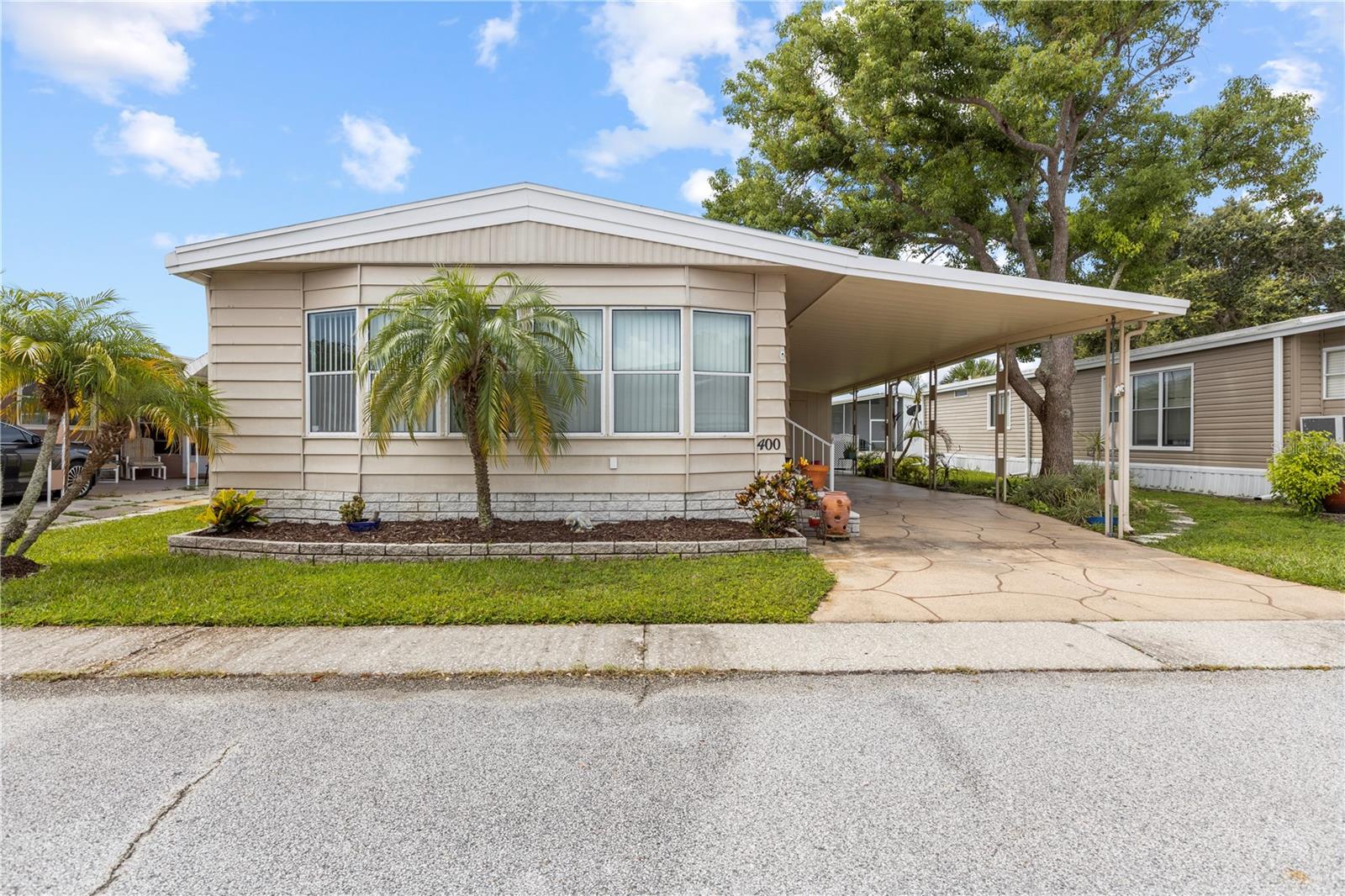Welcome to your ideal retreat in a vibrant 55+ community! This charming manufactured home has been well maintained and features two spacious bedrooms and two well appointed bathrooms. The inviting living room is perfect for entertaining or unwinding, while the adjacent dining room offers a cozy setting for meals with friends and family. The kitchen comes fully equipped with all appliances included, making it a cook's dream and ensuring convenience for daily living. Plenty of storage and cabinet space! This community is rich in activities offering a range of options to keep you engaged and active. From social gatherings to fitness classes, there's something for everyone. Plus, you'll enjoy the convenience of being a short distance from beautiful beaches, shopping centers, and a variety of restaurants, allowing for easy access to leisure and dining options. Experience the perfect blend of comfort, community and convenience of this delightful home. AC is 2 years old, Flood insurance is required and runs approximately 1K. You can rent this property after just 1 year of ownership. If you are looking for a furnished home, furnishings are negotiable! Start living the Florida lifestyle today!