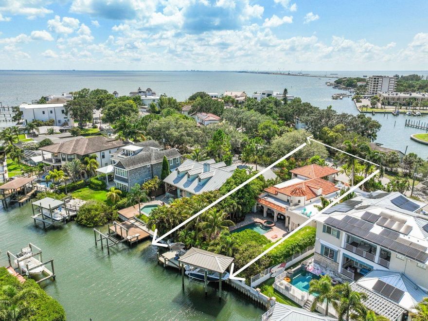 Incredibly Rare Beautiful Mediterranean-style Waterfront Estate will impress you and your friends. One of only a few South Tampa waterfront homes to boast front and rear water views of Tampa Bay. Do not let the recorded age of the home fool you. In 2005 all but approximately 600 Sqft of the original structure was demolished, and the rest was built new. Shortly after the completion of the home, it was featured in the November 2006 edition of Tampa Bay Metro. The article titled “The Ultimate Florida Ranch Renovation.” The are so many unique things about this home. You will be impressed when approaching the Beautiful custom-castle security door at the courtyard entrance leading over a 14 ft handmade bridge from ironwood. The bridge covers over 17 species of large koi and relaxing waterfalls. Both will immediately impress guests before entering the front door of the home. The home lives like a ranch, with all but the second master on the first floor. The home has a modern open-concept floor plan with 20 ft ceilings. Unlike other newer homes, there are no steps to enter or leave the residence allowing the inside and outside to blend seamlessly. You will not find another South Tampa waterfront home that combines all these unique features into one house. The home sits on an oversized, nearly 11,500 Sqft homesite featuring over 6,000 under-roof square feet. The property has nearly $400k worth of landscaping that has taken years to mature. It sets the tone for the feel of the house, with the home thoughtfully designed around the lush greenery. Virtually every room has large windows and sliding doors that perfectly frame this incredible tropical oasis. When you walk outside and have your favorite music playing, you feel like you are on vacation at a 5-star resort. When you open the rear sliders, you will immediately notice the depth of the homesite. There is approximately 72 ft from the back slider to the edge of the rear property line. This allows for an unheard-of 40 ft vertical pool and spa. The backyard has multiple areas to entertain. From the fully equipped outdoor kitchen with natural gas Viking grill and hood system with two additional burners, refrigerator, and station and sink to prep. If you want to smoke a cigar or enjoy your favorite beverage, the natural gas firepit is under the gorgeous pergola w/ 10 ft columns and mature purple wisteria that has perfectly grown around the stone columns. The inside was constructed of the finest materials by some renowned artisans. All the custom woodwork throughout the home was done by Rex Montgomery, a brilliant woodworker who has created works for Paloma Picasso’s home in Miami and many other renowned estates. The list of all the custom upgrades is far too long to include here. Please reach out and request the list. **Recent Market Activity: 42 Sandpiper Rd Sold--$12.35M. 20 Sandpiper Rd Sold--$9.026M.**