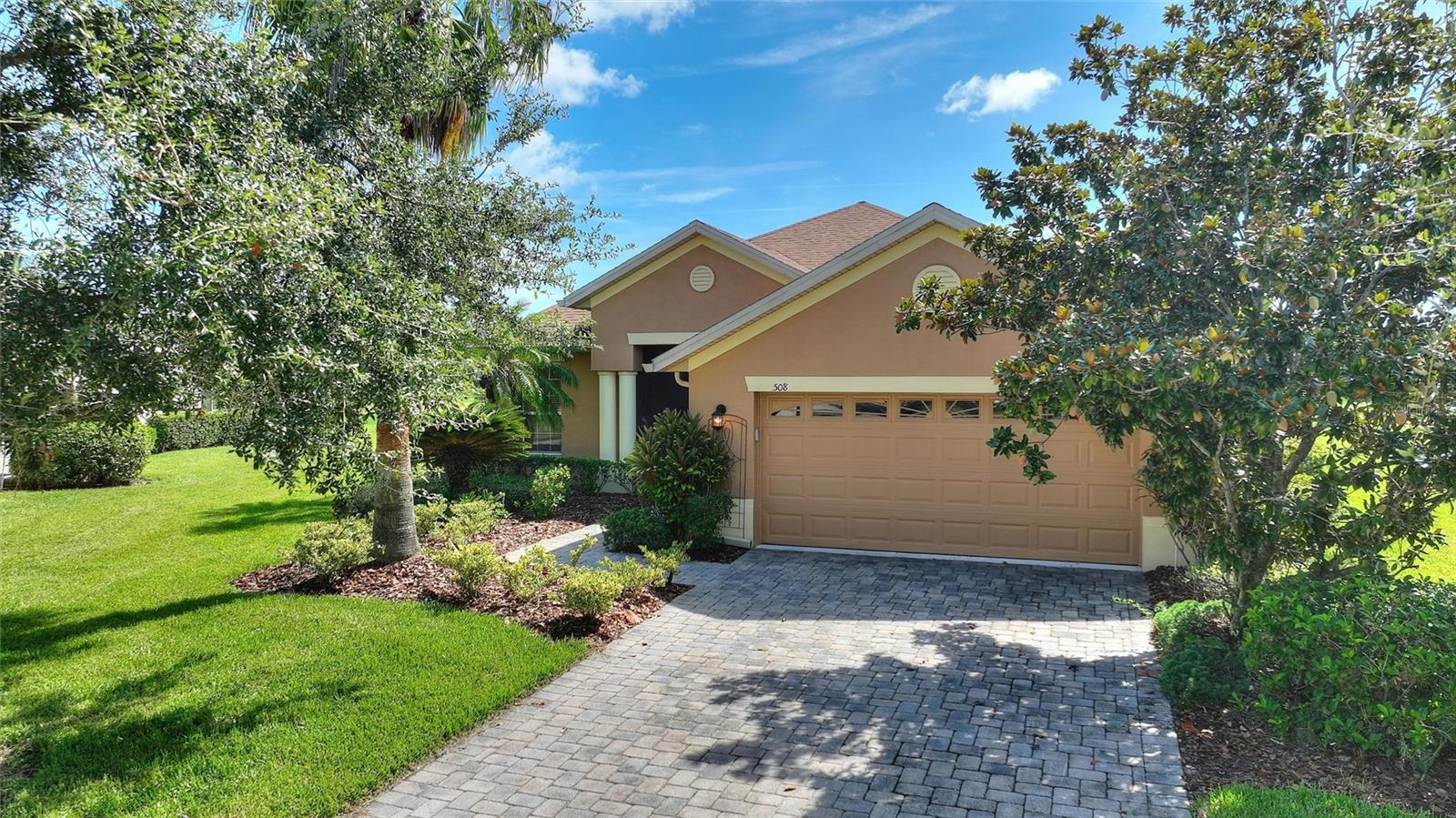 For sale is a charming Melody model nestled in a serene low-traffic loop within the lovely Bella Viana neighborhood. This delightful home boasts 3 cozy bedrooms and 2 well-appointed baths, offering breathtaking views of lush trees, tranquil waters, and golf greens—ideal for unwinding in your lanai while enjoying the natural beauty surrounding you. You'll find no carpets here, as the spacious main living area is elegantly tiled, while the bedrooms showcase stylish wood laminate flooring, recently updated for a fresh feel. The Dinette features an optional 4-foot bump-out, perfect for enjoying your meals. The garage is a true asset, equipped with a sleek epoxy floor and a 4-foot extension that gives you ample space for both your vehicle and a workshop, or extra storage. The garage door opener was just replaced with a brand new quiet opener. The ever-popular Melody model includes a generous great room/dining room that’s fantastic for entertaining, while still providing a separate kitchen. Cook with ease in your efficiently laid out kitchen, featuring granite countertops and brand new Samsung appliances, introduced in 2025. Freshly painted interior rooms add to the inviting ambiance. The roof and HVAC system were both replaced in 2016. Come and experience the warmth and tranquillity that this home has to offer! PLEASE SEE THE 3D MATTERPORT TOUR FOR AN IMMERSIVE WALK THROUGH OF THE HOME. Make the award winning Active 55+ Community of Solivita your new home today. Featuring 14 Pools, 2 Championship 18 Hole Golf Courses, Tennis, Pickleball, basketball, softball, over 240 clubs, walking trails, spa services, plus two state of the art exercise facilities with 4, 200 acres of wetland and conservation. Both 18 Hole courses are challenging, highly rated PGA courses. The Cypress 18 Hole Course was awarded by Golf Digest as one of Best Places to Play . Take your golf cart for a spin downtown to dine and/or share a cocktail with friends or to enjoy the many, many activities that Solivita has to offer. HOA includes lawn service, landscaping maintenance, recycled water irrigation AND high-speed fiber connection that provides streaming TV and 1Gbps High Speed Internet. For your convenience, HCA Florida Poinciana Hospital is directly across the street along with a 42, 000 square-foot medical office building. Also opening across the street is the new Poinciana Lakes Plaza. Here are some of the stores that have already opened or will be opening soon: Sprouts Farmers Market, Petco, Rack Room Shoes, 5 Below, Ulta, TJ Maxx, Ross, Burlington, TD Bank, Hair Cuttery, Outback, First Watch, Five Guys, Popeyes, Bojangles, Coldstone; along with current Walgreens, Wells Fargo, Little Ceasars, McDonalds and more! Please do not hesitate to schedule your private tour of 508 Villagio Loop today and start living your Florida dream.