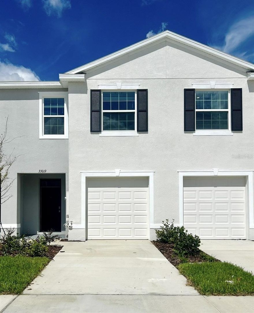 Move-In Ready! Welcome home to a beautifully 3-bedroom, 2.5-bath townhome in the desirable Westgate at Avalon Park community. This spacious and modern residence offers an open-concept floor plan with abundant natural light.
The kitchen features stainless steel appliances, granite countertops, and a large breakfast bar, perfect for everyday living and entertaining. Upstairs, the primary suite includes a walk-in closet. Two additional bedrooms share a full bathroom, providing ample space for family, guests or a home office.

Enjoy the community amenities including a resort-style pool, playground, and walking trails. Located just minutes from SR-54 and I-75, you'll have quick access to Downtown Tampa, Lakeland, and Wesley Chapel's premium shopping and dining, including The Shoppes at Wiregrass, Tampa Premium Outlets, and AdventHealth Center Ice. Zoned for top-rated Pasco County schools, this home offers both comfort and convenience in one of the area's fastest-growing communities. Schedule your showing today!