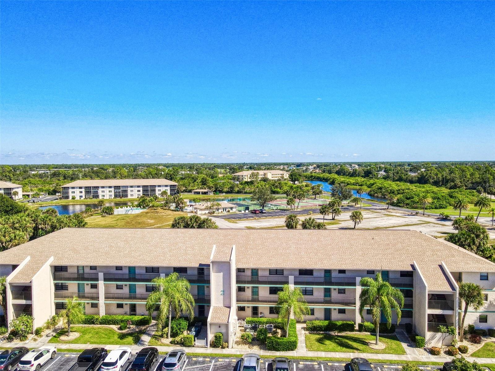 Pride of ownership shows in this well- kept MOVE-IN READY second floor 2-bedroom, 2-bath TURNKEY Condo, located in the desirable Newport Condominium community. This FURNISHED condo is complete with the convenience of access to an ELEVATOR. The spacious primary suite features a large walk-in closet and a private bath with a walk-in shower. The guest bedroom is ideal for family or visitors, with a nearby full bath including a tub. The kitchen offers GE appliances—refrigerator, dishwasher, microwave, and disposal—and the in-unit laundry room adds convenience with a washer, dryer, and extra storage. Enjoy peaceful views of the tennis courts, pool, and lake from your screened balcony—perfect for watching beautiful Florida sunsets. Newport Condominium is ideally located close to shopping, dining, and entertainment at Port Charlotte Town Center Mall, with quick access to Englewood Beach, Boca Grande, and Charlotte Harbor for boating, fishing, and waterfront dining. Golf courses, parks, and nature trails are nearby, along with medical facilities and everyday essentials. Easy access to I-75 makes travel to Sarasota, Fort Myers, or Naples a breeze. This well-cared-for condo offers the perfect combination of comfort, location, and convenience—A MUST SEE!