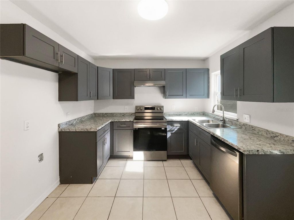 Photo of 3017 E Idlewild Avenue, Tampa, FL 33610 (MLS # O6375594)