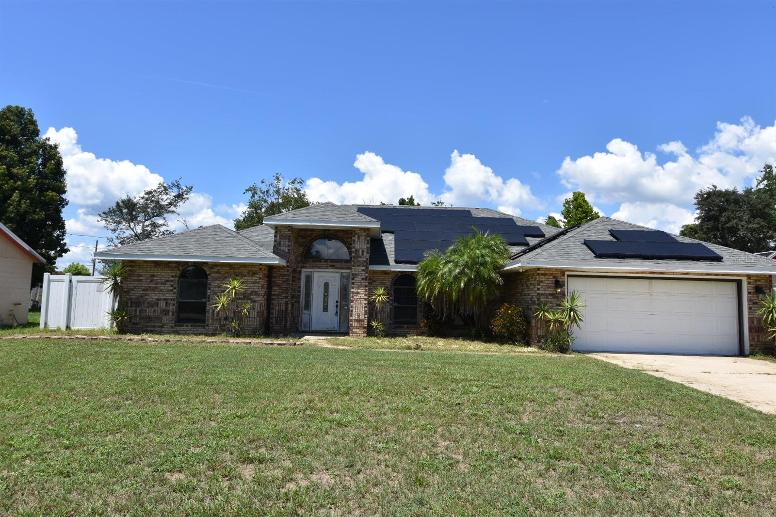 Fractional Ownership. Welcome Home!!! This home has a newer roof with solar panels, privacy fence, ceiling fans, multiple skylights, granite counters, Stainless Appliances & more. High ceilings, large master bath, screen enclosed pool! Features formal living & dining rooms plus a large family room with magnificent floor to ceiling brick fireplace, split bedrooms, French doors from Master to Bathroom and 1 sliding glass door from family room and French doors from Dining Room and back bedroom opening to the under truss tiled screened porch overlooking the pool area, beautiful wood doors and trim throughout, tinted widows for energy efficiency and soaring ceilings with two bright skylights! This is Florida living at it's best- Great for entertaining! Don't miss out...Shows builders Quality throughout and lots of updates for you! Motivated Sellers!!!