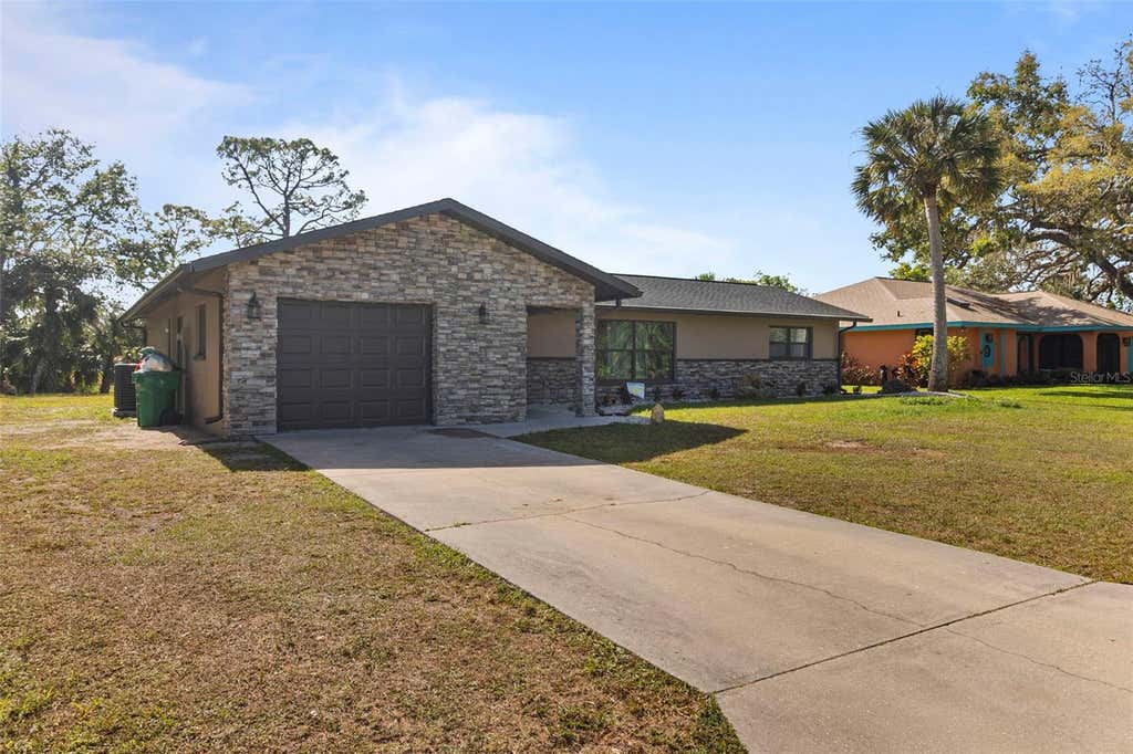 Photo of 20495 Albury Drive, Port Charlotte, FL 33952 (MLS # O6432486)