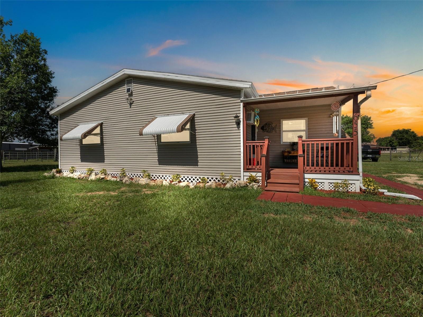 Charming 3-bedroom, 1-bath home on 2 fully fenced acres, perfect for those seeking a rural lifestyle with modern conveniences nearby. Property features a horse stall, chicken coop, and multiple outbuildings for storage or hobbies. Open pasture areas are ideal for grazing, gardening, or expansion. Inside, the home offers a functional layout with cozy living spaces ready for your personal touch. Located in a quiet area with easy access to Bartow amenities, this property is a rare find for equestrian enthusiasts, hobby farmers, or anyone wanting space to spread out.