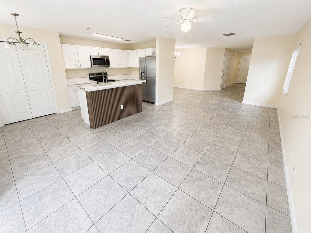 Photo of 13507 Tea Rose Way #128, Orlando, FL 32824 (MLS # O6437250)