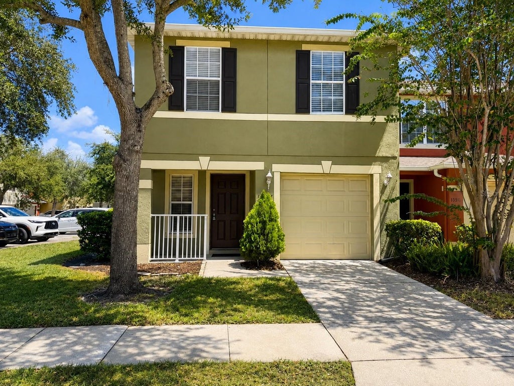 Photo of 13507 Tea Rose Way #128, Orlando, FL 32824 (MLS # O6437250)