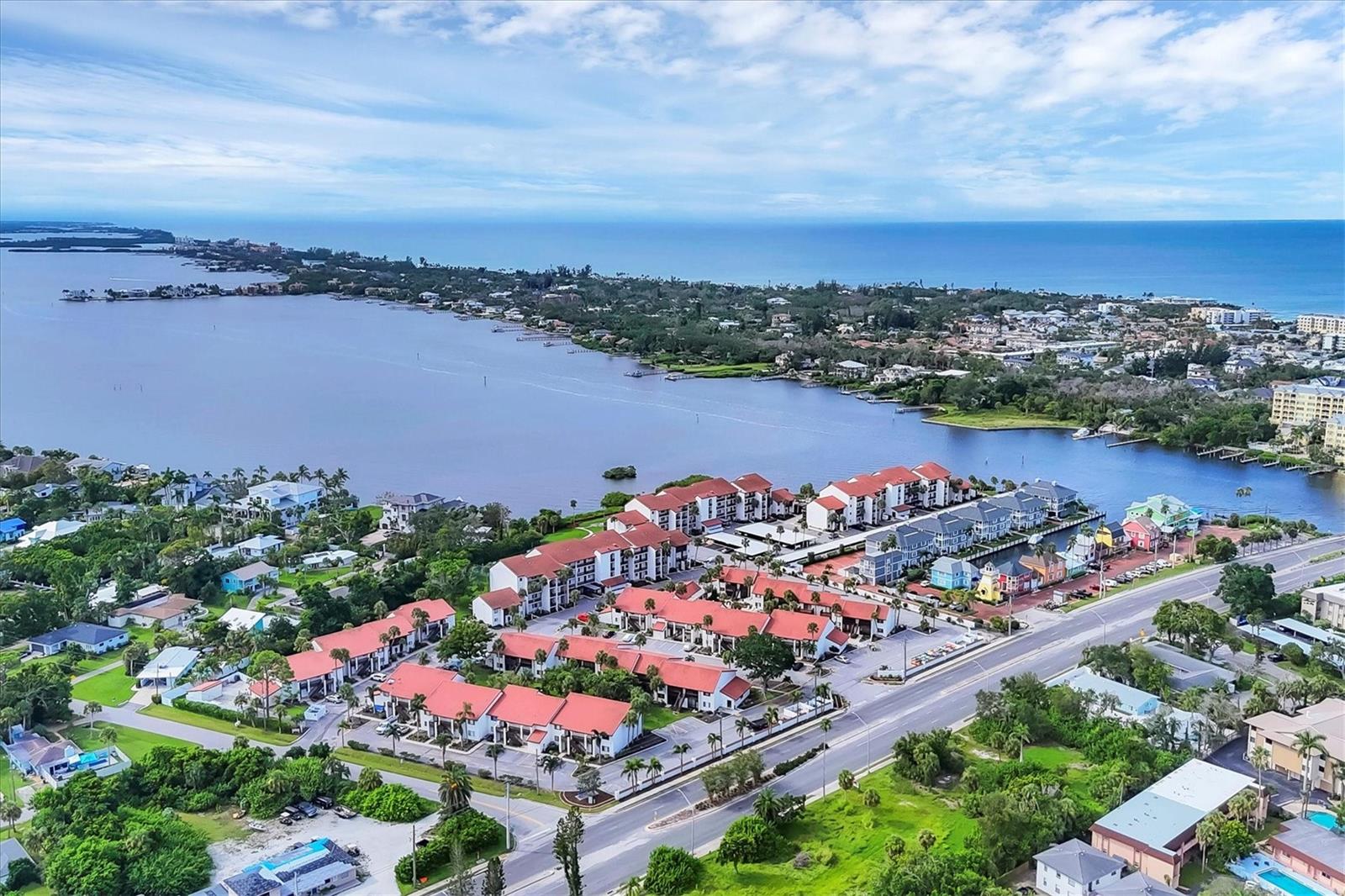 Fully furnished and move-in ready, this delightful ground-floor condo at Castel Del Mare is perfectly situated on the mainland side of Little Sarasota Bay, right along the Intracoastal Waterway. Just a short stroll or bike ride across the bridge leads you to the stunning white quartz sands of Siesta Key Beach — yet this property offers a rare chance to own in paradise at a fraction of Siesta Key prices. Positioned directly on the waterfront, Castel Del Mare delivers a true resort-style living experience, with an impressive array of amenities including a circular bayside pool, a lap pool by the clubhouse, a fishing pier, kayak launch and storage, bayside gazebo, boardwalk, outdoor grilling areas, tennis/pickleball court, shuffleboard along the water, and an on-site property manager. Tucked away from the main road and offering serene wooded views, this ground-level unit means no stairs or elevators to worry about. It’s ideally located just steps from the clubhouse and lap pool for added convenience. The spacious open-concept living and dining area allows for comfortable entertaining, with sliding doors opening to a private, screened-in lanai—perfect for relaxing in the sun or stepping right out to the backyard and nearby tennis court. A storage closet off the lanai is perfect for beach gear. The kitchen includes a handy pass-through window to the living area, making serving and socializing a breeze. The bedroom features a walk-in closet, and an ensuite bathroom with a tub/shower combo. A large south-facing window adds natural light and more views of the trees outside. Three ceiling fans throughout the unit help maintain a cool, coastal breeze.
Located just next door to a charming waterfront marina, shops, a waterfront dining spot, and a boat club with options for memberships in boating, fishing, and watersports. Plus, you’re only five minutes from Publix, pharmacies, and a variety of excellent mainland restaurants.
Whether you're looking for a full-time residence, seasonal getaway, or rental opportunity, Unit #102 at Castel Del Mare is a fantastic find. Enjoy the relaxed waterfront lifestyle today!