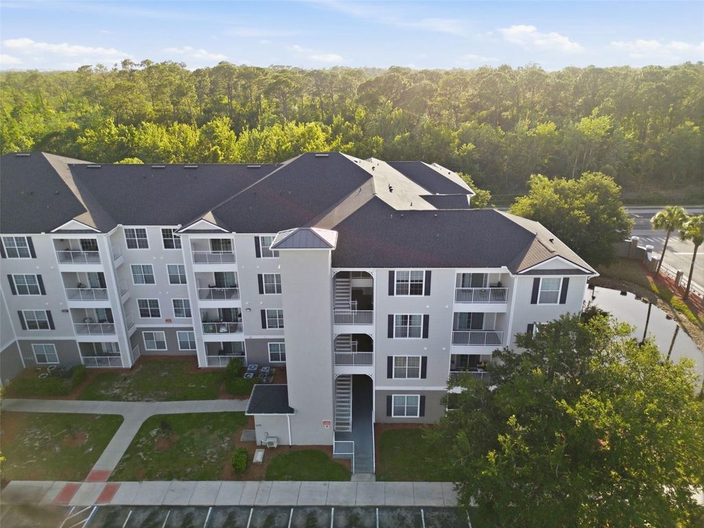 Photo of 3176 Feltrim Place #302, Kissimmee, FL 34747 (MLS # O6412114)