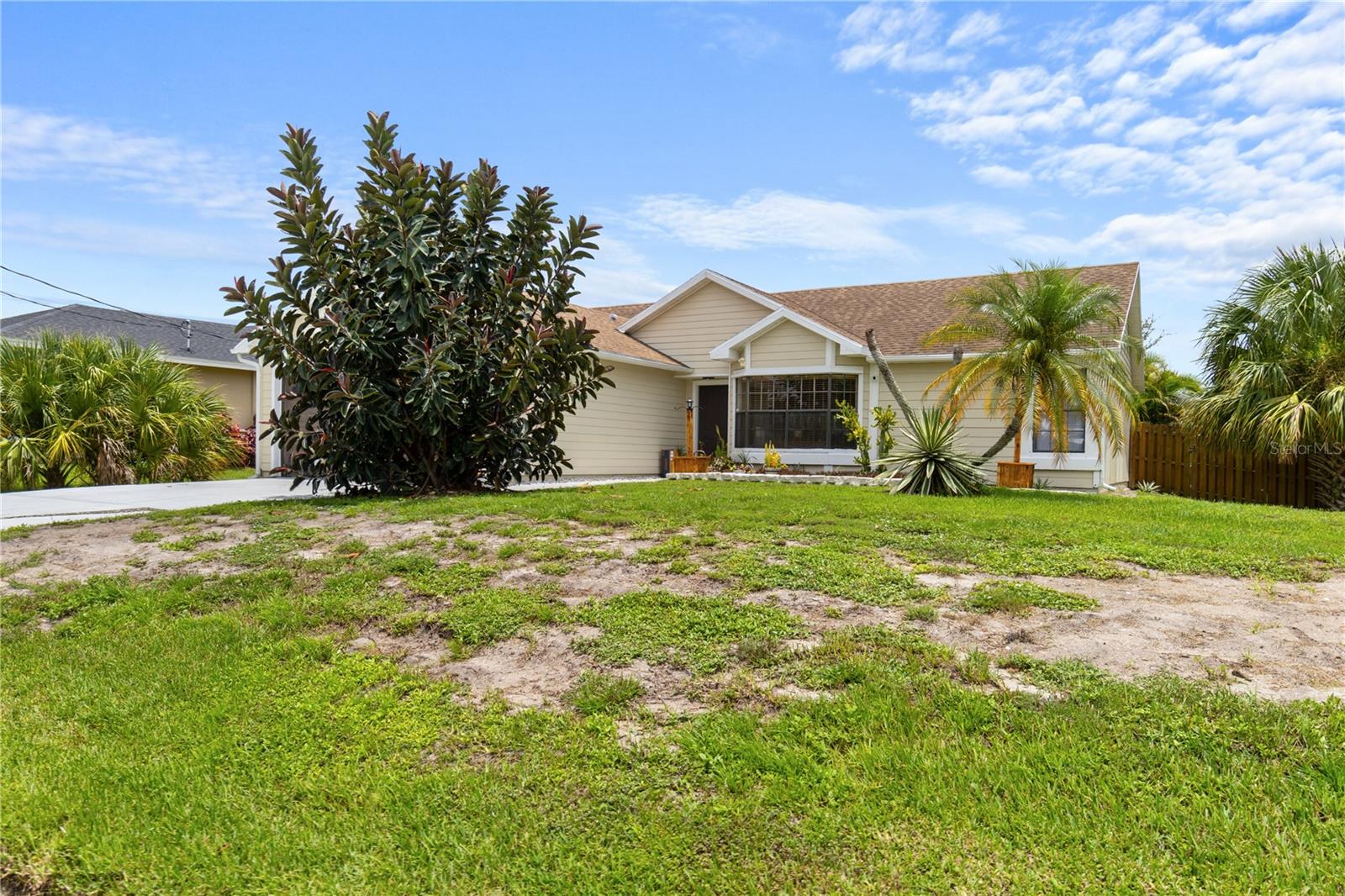 Short Sale. Welcome to 1921 SW Granello Terrace! This beautifully maintained 3-bedroom, 2-bath CBS home sits on a spacious quarter-acre lot in a quiet, desirable neighborhood with no HOA. Featuring an open floor plan with vaulted ceilings, this home is filled with natural light and perfect for entertaining. The kitchen offers ample cabinetry, an eat-in breakfast nook, and a pass-through to the screened lanai. The primary suite includes a walk-in closet, dual vanities, and a soaking tub with separate shower. Enjoy Florida living year-round with a large covered, screened-in patio and a fully fenced backyard. Don’t miss this move-in ready gem!