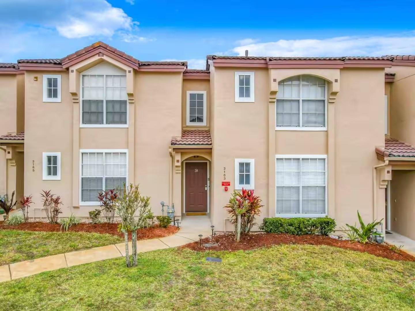 Rarely available & fully upgraded! This 2BR/2BA townhome in Villages at Mango is just 15 minutes from Disney and approved for short-term rental. Generating up to $35K annually with potential for more, it’s a standout investment or dream vacation home. Over $50K in upgrades include a sleek kitchen with quartz counters & stainless appliances, spa-inspired bathrooms, luxury vinyl plank flooring, and designer lighting. The open-concept layout offers vaulted ceilings, a versatile loft, and a screened lanai overlooking green space. Enjoy community amenities like the pool, clubhouse, and pond with fountain views. Turnkey, stylish, and income-producing—this is Florida living at its best!