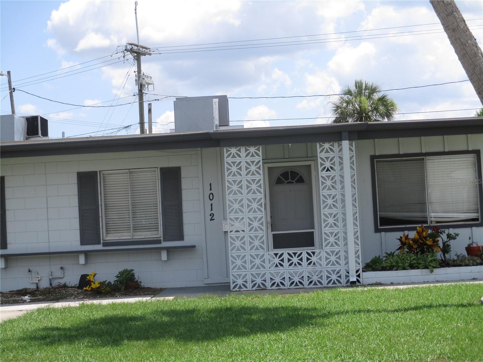 ANNUAL LEASE ONLY. Enjoy the convenience of living across the street from the Community Association (C.A.) in this one bedroom, one bath property. There is a 2 car garage and space for extra parking in the back of the unit. There is easy care tile throughout. The kitchen has a refrigerator (no ice maker), built in microwave, ceramic top stove and washer. The dryer is located in the garage. The bedroom has a wall closet and a bonus room off it perfect for crafts, doing puzzles or just relaxing and reading. The full bath has a tub with grab bars. Central heat and air as well as ceiling fans in the living room, bedroom and bonus room will keep you comfortable all year round. Water, lawn care and two memberships to the C.A. are included in the rent. Most small dogs or cats are welcome. No smoking.