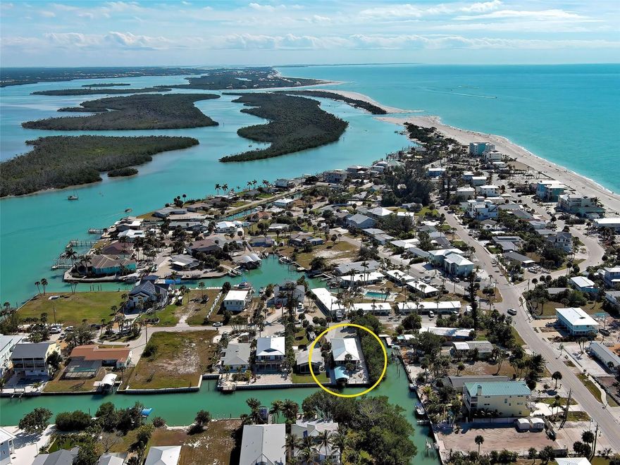 Exceptional canal-front home with deeded access to Englewood Beach, offering the best of Englewood’s coastal lifestyle. Ideally positioned with over 200 feet of canal frontage. The adjacent mangroves provide natural privacy uncommon on the Key. A setting that captures the quiet charm and beauty that makes Manasota Key so special. Updates include AC (2021), kitchen upgrades and appliances (2021), impact windows and sliding door in the living area upstairs (2022), storm-rated garage door (2024), a new 200-amp electric panel, and on-demand water heater (2025). Outdoor improvements feature Hardie board siding, a new deck and stairs, and reinforced soffit supports. Boaters will appreciate direct Gulf access with no bridges and a seawall, 10,000-lb boat lift and covered boat port that were all installed in 2022. A metal roof installed in 2021 adds additional peace of mind. Multiple outdoor living areas and an outdoor shower enhance the indoor-outdoor living experience. A rare opportunity to own a well-updated canal home on Manasota Key.