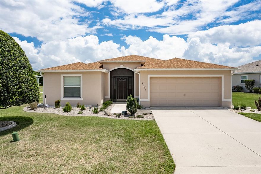 Welcome to this beautifully upgraded and move-in ready 3 bedroom, 2 bath modified floor plan offering approximately 1,807 square feet in the highly sought-after gated golf community of SummerGlen in Ocala, Florida. Located on the 17th tee, this home combines golf course living with major updates already completed including a ROOF (2023), HVAC (2022), updated lighting, new appliances, kitchen remodel, pullout kitchen cabinetry, under-cabinet lighting, and an enclosed Florida room under air that is included in the living square footage. Inside, you’ll find an open split-bedroom floor plan with vaulted ceilings, luxury vinyl flooring throughout the main living areas, and no carpet. The spacious living room flows effortlessly into the enclosed Florida room where oversized windows showcase peaceful golf course views and create the perfect spot for morning coffee or relaxing at the end of the day. Sliders from the living room, primary bedroom, and breakfast nook all lead directly into the Florida room, creating a bright and connected layout that truly embraces indoor-outdoor Florida living. The remodeled kitchen features upgraded cabinetry with pullouts, granite countertops, stainless steel appliances, subway tile backsplash, pantry storage, breakfast bar seating, under-cabinet lighting, and a gas range. The primary suite offers Florida room access through sliding glass doors, a walk-in closet, dual sinks, and a beautifully updated walk-in tile shower with designer finishes. The laundry room offers an impressive amount of additional storage with custom cabinetry and pullouts, while extra storage solutions can be found throughout the home. Living in SummerGlen means access to an unmatched lineup of amenities including an 18-hole golf course, on-site restaurant, resort-style pool and hot tub, tennis and pickleball courts, softball field, dog park, RV storage, clubhouse, fitness center, and nonstop community activities. The low monthly HOA fee of $390 includes guard-gated security, lawn mowing, edging, and blowing, trash and recycling pickup, 1 Gbps high-speed internet, 125+ cable channels, premium streaming apps including HBO Max, Disney+, ESPN, Paramount+, and more, plus a $30 monthly restaurant credit that practically puts dinner on the house. If you are looking for golf course living, meaningful upgrades, low-maintenance ownership, and one of Ocala’s most active and social 55+ communities, THIS IS IT.