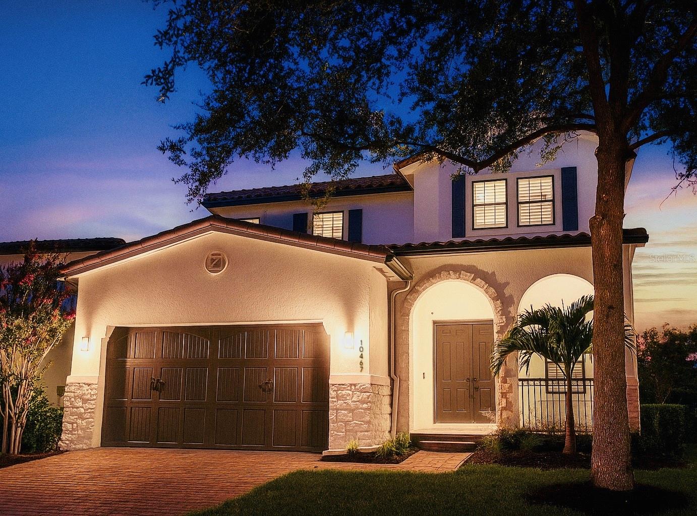 Welcome to your dream home in the guard-gated Eagle Creek Golf Course Community! This fully renovated, move-in ready custom residence offers 5 spacious bedrooms and 4 luxurious full bathrooms, seamlessly blending modern elegance with everyday functionality. From the moment you arrive, the home’s stunning curb appeal, manicured landscaping, and tranquil, low-traffic street create a lasting first impression. Inside, you'll find an open-concept floor plan bathed in natural light, with expansive windows and refined finishes throughout. At the heart of the home is a chef-inspired kitchen, featuring premium Samsung appliances, a custom range hood, dramatic ceiling-height waterfall quartz backsplash, and countertops that are as beautiful as they are functional—ideal for both entertaining and daily living. The main level offers an oversized bedroom and full bathroom, perfect for guests or multigenerational living. Upstairs, generously sized bedrooms and spa-inspired bathrooms provide a luxurious retreat for the entire family. The living area boasts a designer fireplace feature wall, setting the stage for cozy nights or stylish gatherings. Step outside to your private backyard oasis with peaceful canal water views—an ideal backdrop for relaxing or entertaining. Additional upgrades include a brand-new HVAC system and a Tesla charging station, offering comfort and convenience. Enjoy exclusive access to Eagle Creek’s world-class amenities, including golf, clubhouse, fitness center, resort-style pools, and more. This one-of-a-kind, turnkey home is a rare opportunity to own a custom-designed masterpiece in one of Central Florida’s most sought-after communities.