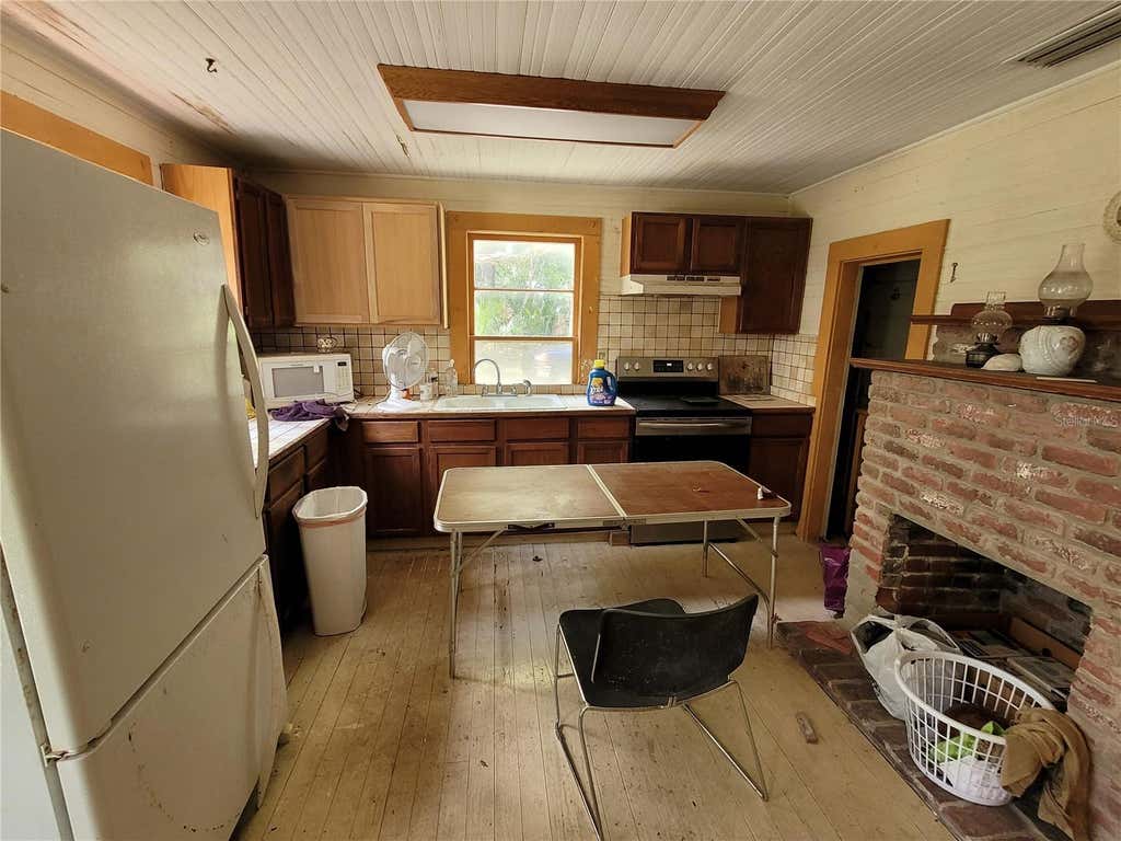 Photo of 801 NE 1st Street, Micanopy, FL 32667 (MLS # O6426072)
