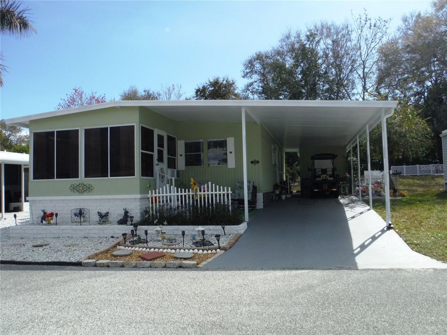 2 bedroom 2 bath at the top of the hill in a no flood zone. This home has a backyard that backs onto a tropical view with trees.  There is a really lovely view from the back patio. Remodeled in beautiful condition with crown molding, newer appliances and much more. Remodeled kitchen with waterproof Luxury vinyl floor.  Master bath has a shower surround with compartments for shampoo and other shower amenities and grab bar. The HVAC is one year old. This home is in terrific condition - very well cared for. It has a double shed with washer & dryer in the front part and a workshop in the back. Gulf Breeze remodeled the front lanai. The 52X70 lot is included in the price since this is a deeded lot. You may have a cat, but sorry, not a dog. Briar Creek is a very much in-demand 55+ community.  It is very friendly with plenty of activities.  Included in the $235 maintenance fee per month is water, sewer, trash, lawn, private roads, a laundry room in case your appliances break. clubhouse, heated pool & spa and shuffleboard.  Room measurements approximate.