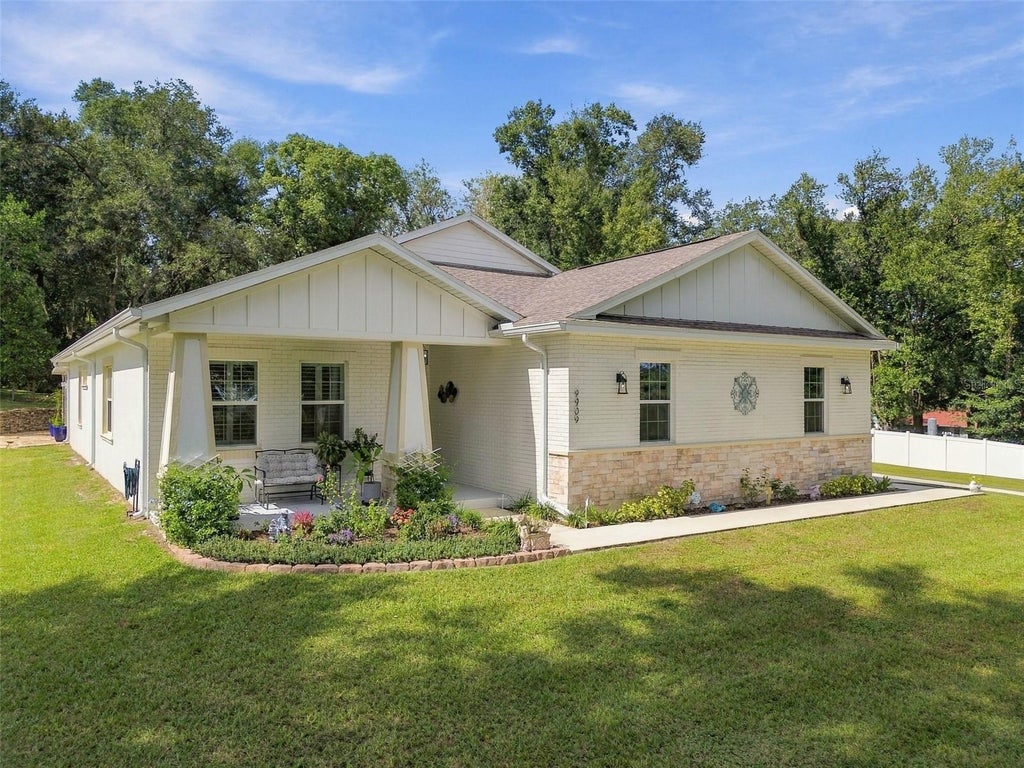 Photo of 9909 Pine Leaf Lane, Dade City, FL 33525 (MLS # TB8557912)