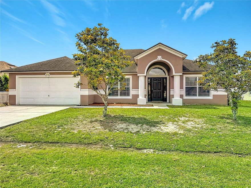 Welcome to 20 Andora Court in Poinciana, a spacious and beautifully maintained 2006 block home offering over 2,200 square feet of comfortable living space. SOLAR PANELS PAID OFF AT CLOSING BY SELLER! This 4 bedroom, 2 bath residence features a bright open floor plan with vaulted ceilings designed for both everyday living and entertaining. Step inside to find tile and brand NEW LVP flooring (luxury vinyl plank). adding a modern touch and durability. The expansive kitchen is the heart of the home, offering ample counter space, generous cabinetry, granite counters, large breakfast bar and a seamless flow into the living and dining areas. Major updates provide peace of mind, including a ROOF 2019, HVAC system 2025, NEW INTERIOR PAINT and a VINYL FENCED Backyard. Inside the home, you will find a formal dining area, family room or office space plus a generous sized living room. All 3 guest bedrooms include a separate hallway for easy access while the primary suite includes a walk-in closet, walk-in shower and soaking tub. The fully fenced vinyl backyard offers privacy and plenty of space for outdoor enjoyment, gardening or pets. The back porch has all NEW SCREENS. Energy efficiency is a standout feature with fully paid-off solar panels at closing—helping keep your power bill incredibly low, averaging around $45 per month. The HOA includes cable and Wi-Fi, with optional access to community amenities such as a pool and fitness center through an additional membership. This move-in-ready home combines space, updates, and long-term savings—schedule your showing today!