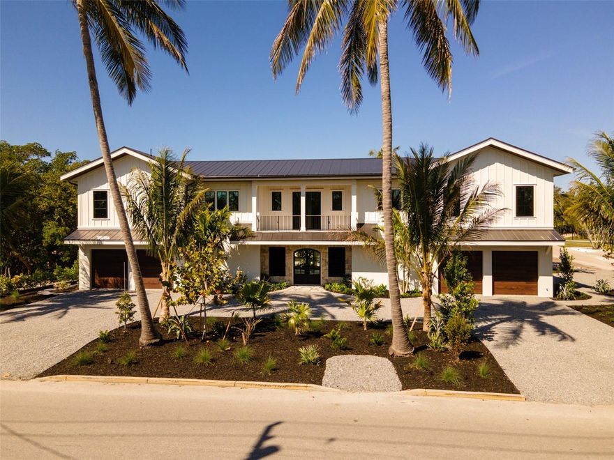 Ready for occupancy. This Coastal Elegance at its finest.  This new home features timely finishes including, hard wood flooring, custom cabinetry, high quality solid surfaces, custom mill work through out, and vaulted ceilings . There is a primary and secondary master suite and two en-suites. The home will have a private elevator, several covered lanais and an amazing tropical pool with spa surrounded by mature landscape. There is a full service outdoor kitchen on the lower lanie for entertaining pool side . For the boaters, there is canal access including a boat dock and 10,000 pound lift with easy access to the ICW and the Gulf of Mexico. Conveniently located in the Historic Village of Longboat Key you have easy access to the beach, which is a short 5 minute walk . You are also a short walk to three of the best local restaurants. . The home is furnished and ready to move into . As a bonus  a custom outdoor kitchen has just been installed to enhance your out door living.