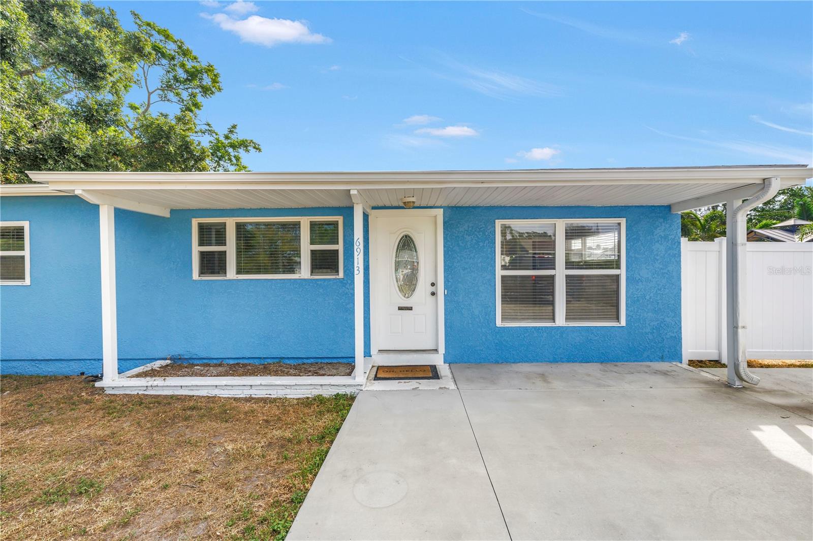Welcome to this incredible 3-bedroom, 2-bath bungalow in the highly desirable Meadow Lawn neighborhood, perfectly blending stylish updates with everyday comfort. Set on an extra-large lot, the home features a fenced backyard with a sprinkler system, a new concrete patio, and an additional parking pad ideal for a boat or trailer. Inside, you’ll find new engineered hardwood flooring throughout, updated windows, fresh new exterior paint, and a new concrete driveway that elevate both curb appeal and value. The large master suite boasts a walk-in closet, engineered hardwood floors, and an ensuite bath with a stunning marble shower, while an adjacent flex space provides the perfect spot for a home office or reading nook. The updated kitchen shines with marble tile floors, granite countertops, stainless steel appliances, and classic white cabinetry, flowing seamlessly to the living and dining areas for effortless entertaining. Two comfortable guest bedrooms share a renovated hall bath finished with crisp white tile and a tub/shower combo. Additional highlights include an updated HVAC (2018) and a convenient laundry room with washer and dryer included. With its modern upgrades, generous outdoor space, and unbeatable location, this Meadow Lawn gem is ready for you to move in and start living your best Florida lifestyle today!