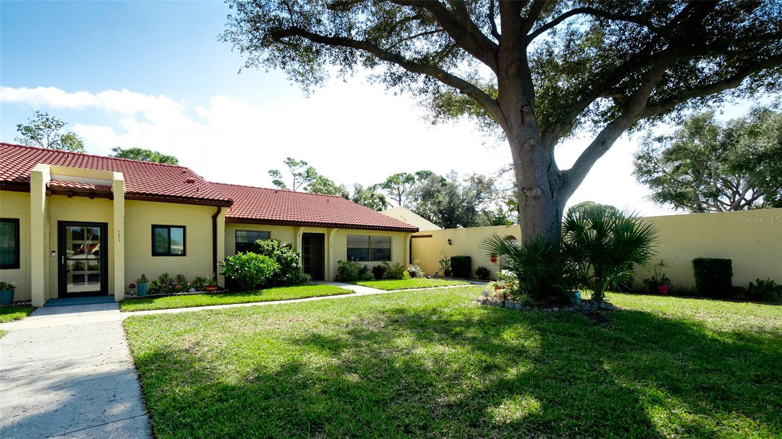 Welcome to your dream villa at 1215 56th St W! This immaculate 1-bedroom, 1-bath retreat offers a perfect blend of comfort and style, featuring a convenient 1-car carport just steps from your front door. Step inside to discover a bright kitchen adorned with beautiful counters and ample space for cooking, complete with a stackable washer/dryer closet for ultimate convenience. Hurricane impact windows and sliding door. Enjoy the elegance of luxury vinyl flooring throughout, while the completely remodeled bath boasts new vanity, counter-top, toilet and beautifully tiled shower. Natural light floods the glass-enclosed Florida room, perfect for relaxation. The inviting dining and living areas are enhanced by vaulted ceilings, creating an airy ambiance. Meadowcroft offers resort-style amenities , including a heated pool, clubhouse, tennis and pickleball courts, all in a vibrant welcoming community. Conveniently located near shopping, dining and a Florida lifestyle. Monthly fee of $423 per month covers: cable, Internet, exterior maintenance, pest control, water, sewer and trash. New carport roof and structure/supports (2025).Don’t miss the opportunity to make this charming oasis your home!