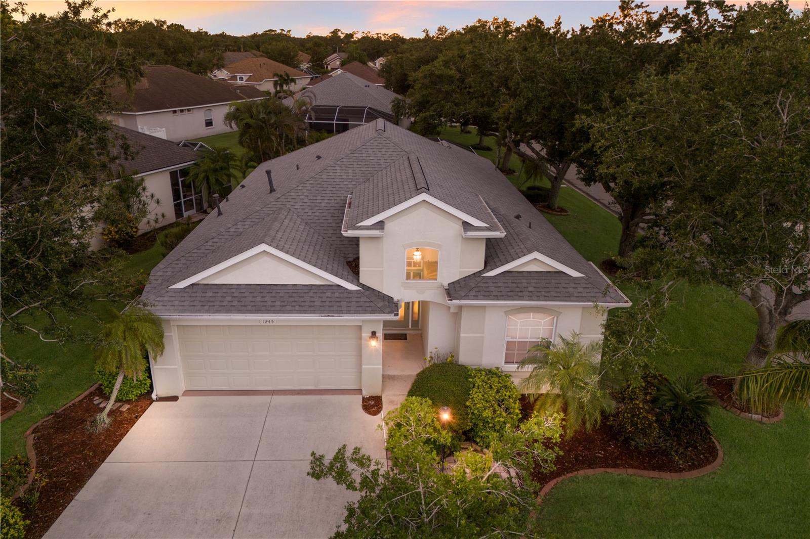 Welcome to maintenance-free living in the heart of Greenfield Plantation—a quiet, friendly golf community with no CDD fees and top-rated schools. Nestled on a spacious corner lot, this beautifully maintained 3-bedroom, 2-bath pool home offers the perfect blend of comfort, style, and convenience. Inside, an open-concept layout is framed with elegant crown molding and designed for both everyday living and effortless entertaining. The formal living and dining rooms flow seamlessly together, while the well-designed kitchen—with its central island—opens to the cozy family room, creating a warm, welcoming space for gathering. The split bedroom floorplan ensures privacy, with two guest bedrooms thoughtfully positioned near the guest bath. The spacious owner’s suite is a true retreat, featuring a sitting area, walk-in closet, private ensuite with dual vanities, and sliding glass doors that lead directly to your screened-in lanai. Step outside and enjoy your own private oasis—complete with an inviting inground pool, perfect for soaking up the Florida sunshine. The low HOA fee includes lawn care, irrigation, a community pool, and grounds maintenance—giving you more time to relax and enjoy life. Golf enthusiasts will love The Links at Greenfield Plantation, a public course with optional play—no membership required. Ideally located in Flood Zone X with easy access to I-75, Lakewood Ranch, downtown Sarasota, Tampa, and nearby airports, this home also places you just a short drive from Florida’s award-winning Gulf Coast beaches. Discover the lifestyle you’ve been searching for—schedule your private tour today!