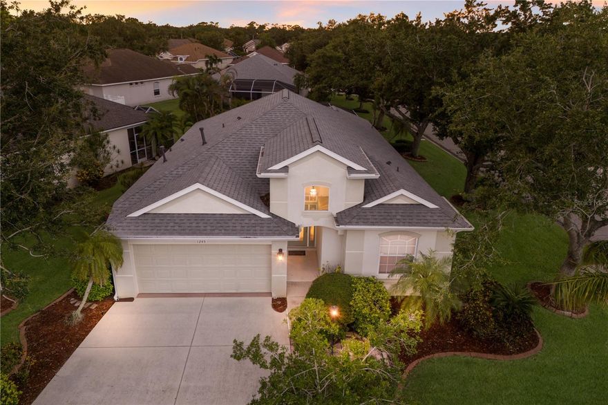 Welcome to maintenance-free living in the heart of Greenfield Plantation—a quiet, friendly golf community with no CDD fees and top-rated schools. Nestled on a spacious corner lot, this beautifully maintained 3-bedroom, 2-bath pool home offers the perfect blend of comfort, style, and convenience. Inside, an open-concept layout is framed with elegant crown molding and designed for both everyday living and effortless entertaining. The formal living and dining rooms flow seamlessly together, while the well-designed kitchen—with its central island—opens to the cozy family room, creating a warm, welcoming space for gathering. The split bedroom floorplan ensures privacy, with two guest bedrooms thoughtfully positioned near the guest bath. The spacious owner’s suite is a true retreat, featuring a sitting area, walk-in closet, private ensuite with dual vanities, and sliding glass doors that lead directly to your screened-in lanai. Step outside and enjoy your own private oasis—complete with an inviting inground pool, perfect for soaking up the Florida sunshine. The low HOA fee includes lawn care, irrigation, a community pool, and grounds maintenance—giving you more time to relax and enjoy life. Golf enthusiasts will love The Links at Greenfield Plantation, a public course with optional play—no membership required. Ideally located in Flood Zone X with easy access to I-75, Lakewood Ranch, downtown Sarasota, Tampa, and nearby airports, this home also places you just a short drive from Florida’s award-winning Gulf Coast beaches. Discover the lifestyle you’ve been searching for—schedule your private tour today!