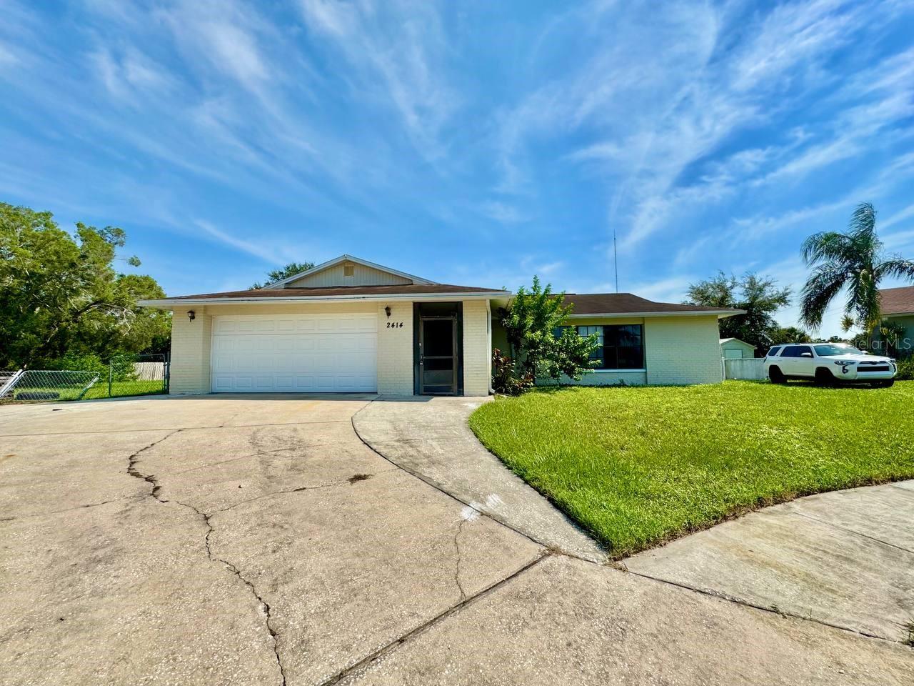 Welcome to this stunning 3-bedroom, 2.5-bath pool home, nestled at the end of a quiet cul-de-sac in the highly sought-after Aloha Gardens neighborhood. Set on an oversized, fully fenced lot nearly 1/3 of an acre, this property offers exceptional indoor and outdoor space rarely found in the area. The expansive backyard is perfect for entertaining, complete with a sparkling pool, large, screened lanai, and plenty of room to park your RV, boat, or extra vehicles truly a unique find. An attached 2-car garage provides additional storage and everyday convenience. Step inside to a bright, open-concept layout filled with natural light. The spacious living and dining areas flow effortlessly, highlighted by oversized sliding glass doors that lead to the backyard oasis perfect for enjoying indoor-outdoor Florida living. With no rear neighbors, you'll enjoy complete privacy and tranquility. The kitchen is a chefs dream, featuring rich wood cabinetry, recessed lighting, a large center island, and a roomy pantry blending style and functionality. Each bedroom offers walk-in closets, ensuring ample storage and comfort for everyone. Ideally located just steps from the Holiday Recreation Center, offering gym facilities, ball fields, tennis courts, and a playground. Plus, you're only minutes from US-19, shopping, dining, downtown Tampa, and some of Floridas best beaches. This home delivers the perfect mix of space, privacy, and convenience dont miss it! In addition to the advertised base rent, all residents are enrolled in the Resident Benefits Package (RBP) for $50.00/month which includes HVAC air filter delivery, credit building to help boost your credit score with timely rent payments, utility concierge service making utility connection a breeze during your move-in, and much more! More details upon application. 2 pets welcome, max 20 lbs. Vacant and Available now!