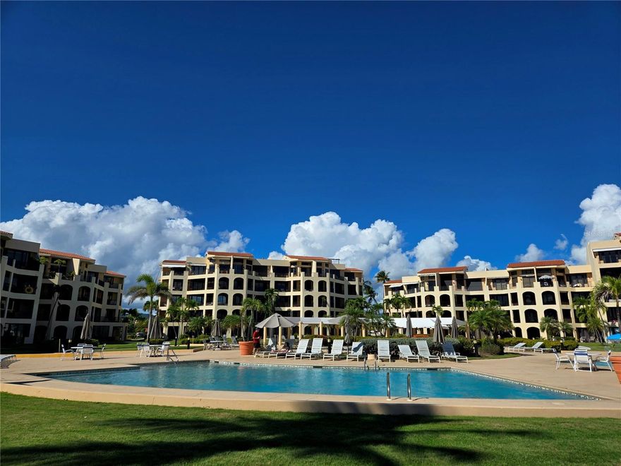 Located in the desirable Crescent Beach complex within the Palmas del Mar Resort in Humacao, this unit enjoys a frontal view of the complex’s swimming pools, recreational areas, and the beach. Crescent Beach is widely regarded as one of the best beachfront locations within Palmas del Mar, offering direct access to the sand and a truly resort-style setting. Surrounded by beautifully maintained grounds and close to golf courses, marina, restaurants, and walking trails, this property is ideal as a primary residence, vacation home, or investment opportunity.