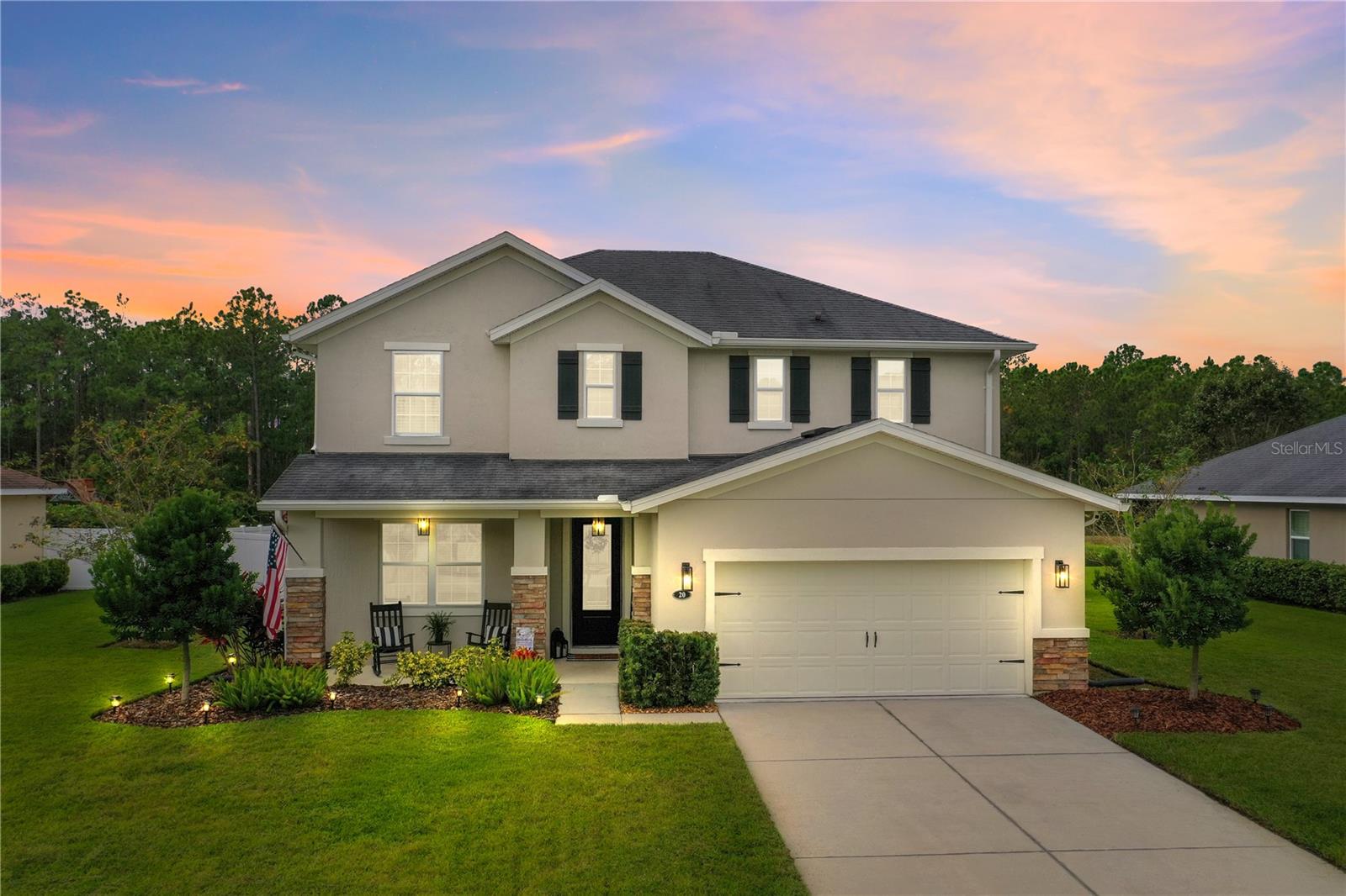 This immaculately maintained 4 bedroom, 2.5 bath, concrete block home is located in the highly sought after community of Hunter's Ridge in Ormond Beach. The flex room can be used as an office or 5th bedroom. This beautifully designed home has an open concept with a large kitchen that overlooks a formal dining area and spacious living room. Kitchen has granite tops, white kitchen cabinets, tons of storage space, and a top of the line Samsung Family Hub 22.2 Cu. ft. stainless steel refrigerator with interactive screen. The primary bedroom has a big walk-in closet with custom shelving and drawers. Primary bath has a soaking tub in addition to a separate stand-up shower, and double sink vanity. Double pane insulated windows. 9 foot ceilings. Wash tub in the garage. Irrigation system. The outside of the home was painted in 2023. Enjoy the evening sunsets as you sit on the screened in back porch that overlooks the fenced-in backyard, which butts up to a peaceful lake and conservation area.