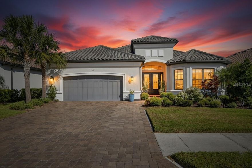 Welcome to 11121 Egeria Drive, where luxury living meets effortless lifestyle in a show-stopping, single-story residence designed for those who don’t just dream big, they live bigger.
Step beyond the gates and into over 3,000 square feet of magazine-worthy interiors, where high ceilings and open spaces create an instant wow factor. Built by Taylor Morrison in 2021, this home is less a property and more a statement of elegance, quality, and intention. Every room, every finish, every detail has been thoughtfully curated to elevate your daily life.
The kitchen is your culinary playground and it’s as functional as it is flawless. Granite counters, a dramatic cooking island, high-end appliances including a gas cooktop and range hood, and a walk-in pantry give you the tools to cook, host, and gather like never before. Flowing effortlessly into the dining area and great room, the layout keeps you connected to every conversation and celebration.
Step outside and experience true Florida resort-style living. Your fully screened lanai opens to an in-ground, saltwater pool that practically shimmers in the sunlight. Fire up the grill in your outdoor kitchen, serve cocktails by the water, or unwind under the stars with your favorite playlist in the background. The lakefront view is the ultimate backdrop.
And when the party’s over or you just need a little solitude, retreat to your primary suite sanctuary, complete with luxury vinyl floors, dual walk-in closets, and a spa-inspired ensuite bath featuring stone counters, dual sinks, and a multi-head shower that makes every morning feel like a five-star hotel. Two additional bedrooms, including a guest suite with its own private bath, plus a bonus den or office give you flexibility to work, host, or just live expansively.
But the lifestyle doesn’t stop at your doorstep. Living here means having access to a vibrant recreational center just moments away. Start your mornings in the state-of-the-art fitness center, meet neighbors for a round on the tennis courts, or bring the little ones to the playground for sun-soaked afternoons of fun. It’s all here and it’s all yours.
From hurricane shutters and energy-efficient upgrades to a spacious two-car garage and dedicated laundry room with gas hookups, no box is left unchecked. This home was built for effortless everyday living and unforgettable entertaining.
If you’re looking for more than just a place to live, if you want a home that inspires, impresses, and elevates, then welcome. Because 11121 Egeria Drive isn’t just where you live. It’s how you live.