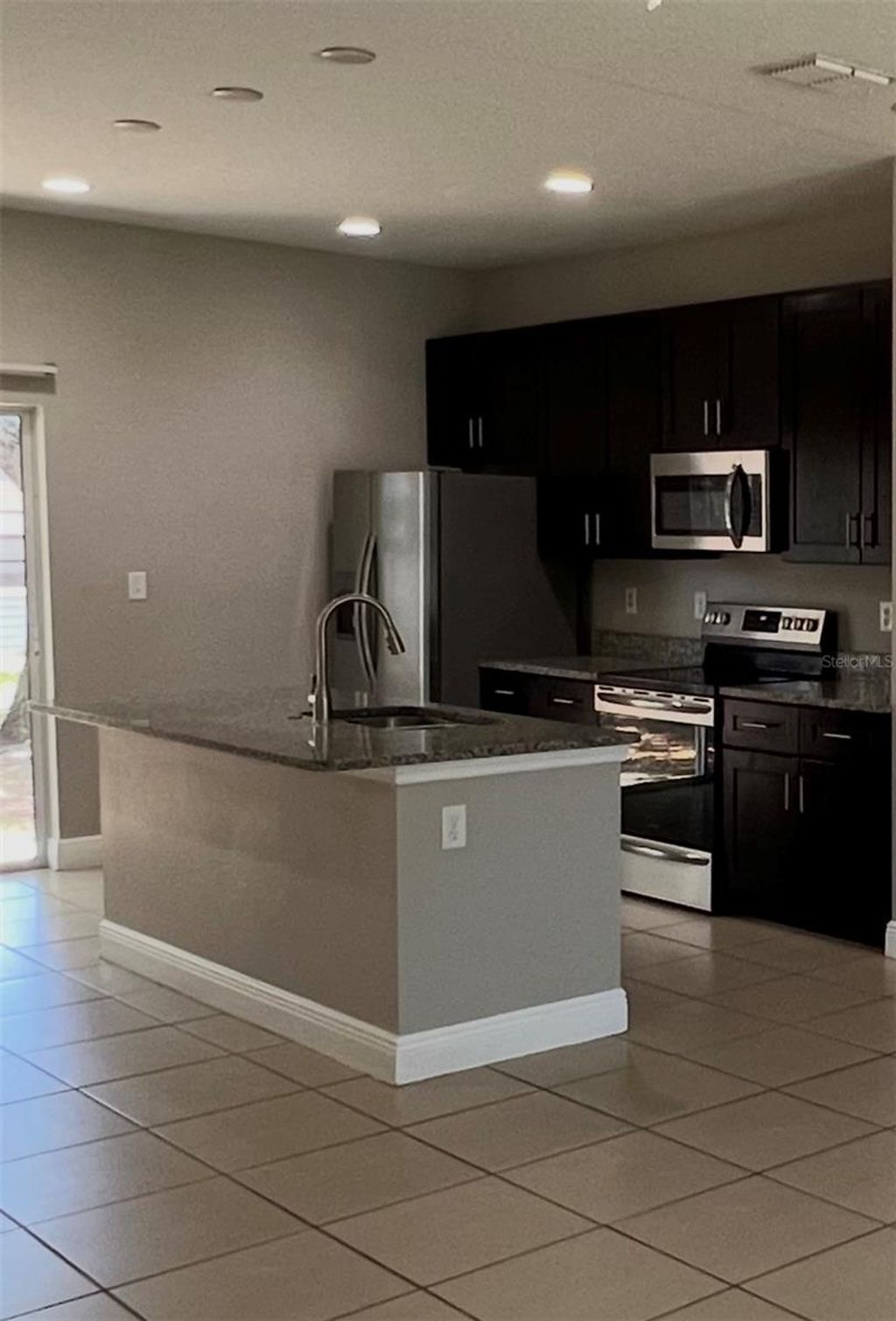 Photo of 528 Finch Lane, Kissimmee, FL 34759 (MLS # O6403502)