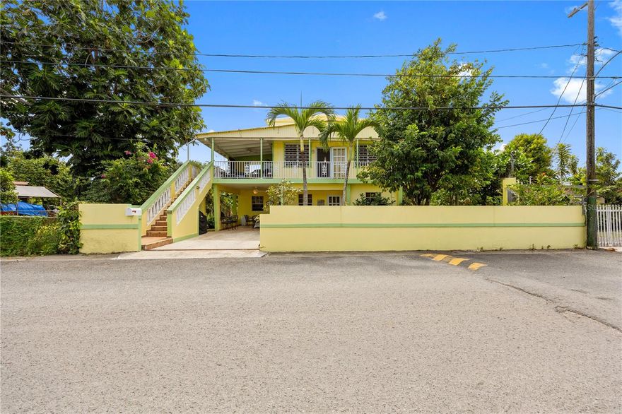 Charming Furnished Home in the Heart of Rincón – less than 300 meters to the Beach!
Located in a prime area of Rincón, this charming two-story home offers the perfect blend of tropical living and convenience. Just a short walk to the beach, this property is ideal for those looking to enjoy the relaxed coastal lifestyle that Rincón is famous for. The home features a welcoming façade with tropical landscaping, a spacious balcony/terrace, and a private gated entrance with driveway parking. The elevated upper level provides a bright and airy living space, perfect for enjoying the Caribbean breeze. Inside, the property offers comfortable living areas and a functional layout with plenty of natural light. The outdoor areas and balcony provide great space for relaxing, entertaining, or simply enjoying the peaceful neighborhood surroundings. This property is being sold furnished, making it move-in ready and an excellent opportunity for a primary residence, vacation home, or investment property in one of the most desirable towns on Puerto Rico’s west coast.