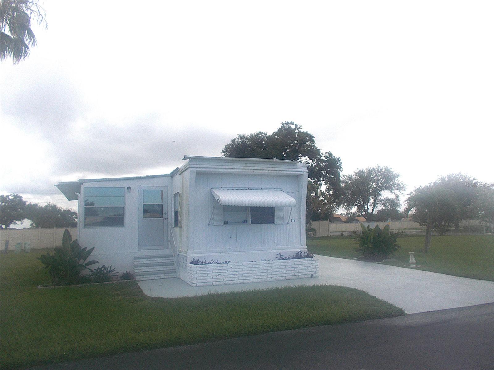 This 2 bedroom 1 1/2 bath single wide mobile had extensive renovations completed. . . . . . and then Hurricane Milton came along. Repairs are possible, but you may decide to start from scratch instead. Either way, this mobile sits on one of the nicest lots in Sandalwood so it's a win-win! Sandalwood Park is also pet friendly with no weight restrictions! Bring your furry family members to enjoy the new dog park. Sandalwood offers its residents a full social calendar featuring bingo nights, card nights, potluck dinners, concerts, happy hours at the pool patio and so much more! The location is fabulous too. Just minutes to Venice's premier beaches, restaurants, Sarasota Memorial Hospital and shopping. Don't miss out on this opportunity!