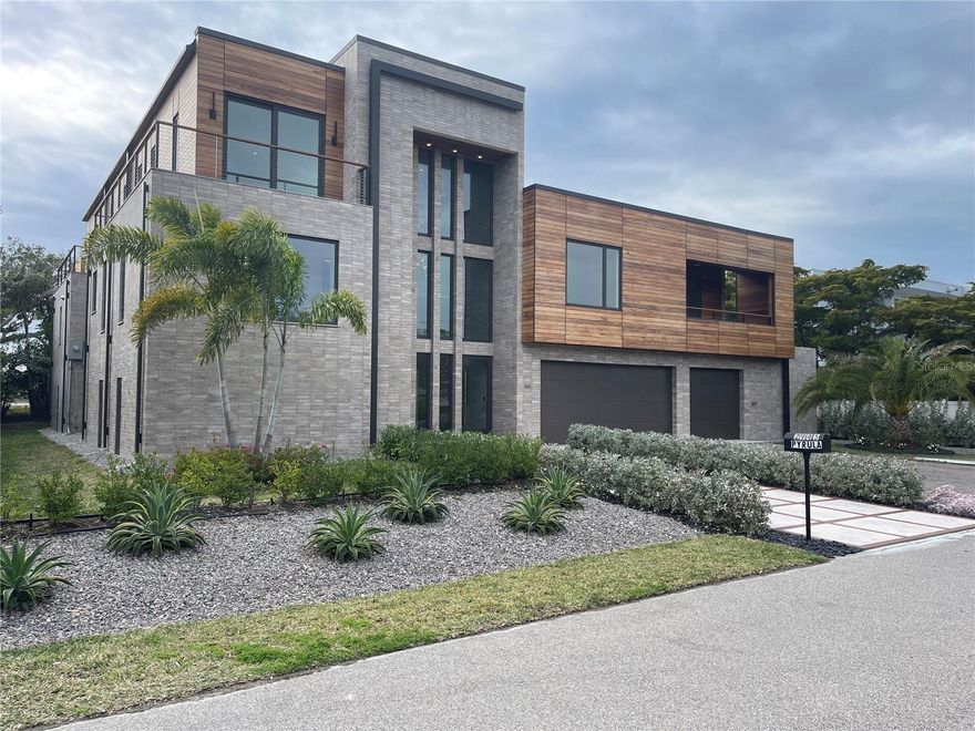 A contemporary masterpiece awaits, constructed in 2024 and completed in 2025 this newly built residence blends contemporary architecture with uncompromising craftsmanship. 
Step into more than 3,800 square feet of modern design perfection ideally located in one of Longboat Keys most coveted neighborhoods. Just minutes on foot brings you to pristine beach access or a tee time at the prestigious Longboat Keys club. 
Seamless indoor- Outdoor living, a stunning floor to ceiling glass wall sets the tone from the moment you walk in revealing a private courtyard that feels like your own luxury resort, complete with an elegant pool, a relaxing spa, and a fully equipped outdoor kitchen and dining area.
This harmonious flow creates an exceptional living experience where the outdoors becomes an extension of the home .
Refined interiors inside , warm oak wood flooring runs throughout the home beautifully paired with stone accents , sleek cabinetry , and high end finishes.
The chef designed kitchen is crafted for culinary excellence and features quartzite countertops prized for their durability, beauty, and unmistakably high end character.
The primary suite is a serene retreat with glass walls overlooking the courtyard , a soaking tub , a separate shower, and generous storage.
Spaces designed for comfort the home offers five bedrooms including 
An in law suite with a kitchenette, private laundry, spacious bedroom, and walk in shower.
An additional bedroom on the main level with its own private balcony .
Upstairs two guest suites connected by a bright relaxation area with courtyard views through the floor to ceiling glass.
Striking modern architecture, the exterior showcases clean contemporary lines enhanced by rare hand selected stone and rich custom woodwork. 
Come visit this spectacular offering.